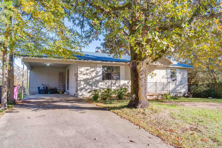 Check out this spacious two bedroom with a lake view! Located in southeast Conway just 3.5 miles off I-40, you can enjoy the conveniences of the city without the restrictions; and even better, it can qualify for 0% down rural development loans! This hilltop home is not in the flood zone, has a metal roof, fenced in back yard, large bedrooms and living area, and a big laundry with extra storage. The kitchen has plenty of cabinets and countertop space and is open to the dining room, which leads outside to a covered back porch and patio facing Lake Conway, perfect for backyard barbeques or enjoying the sunrise over the water. Admittedly, the house could use some aesthetic work but it's been trouble free for the current owners, and gives the buyer a chance to add their own personal style with a more affordable than average up-front cost. And an extra bonus if you qualify- the seller is offering a 2.75 assumable VA loan!
