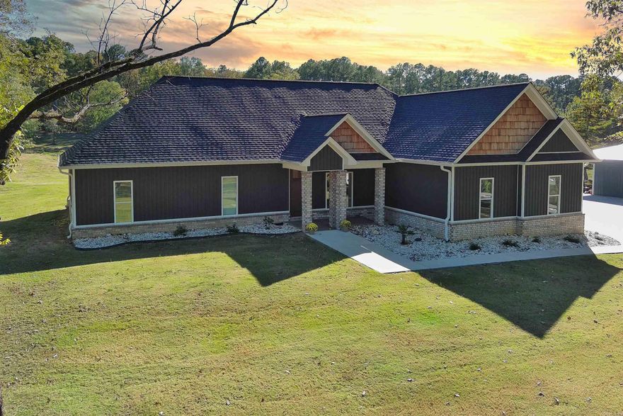 Built in 2021 on 3.45 acres.4 bedrooms, 2 full baths one half bath. Open floor plan. Kitchen has large island with quartz countertops and backsplash, and a coffee nook. Laundry room connects to the primary bedroom. Outdoor kitchen includes hibachi and gas grill with a gas fireplace.  30x30 heated and cooled shop with 10ft lean-to. Enjoy fishing in your back yard in the pond. Walking distance to Sheridan Golf Course. No Restrictions in neighborhood. Va assumable with an eligible Veteran. Ask Realtor for details.