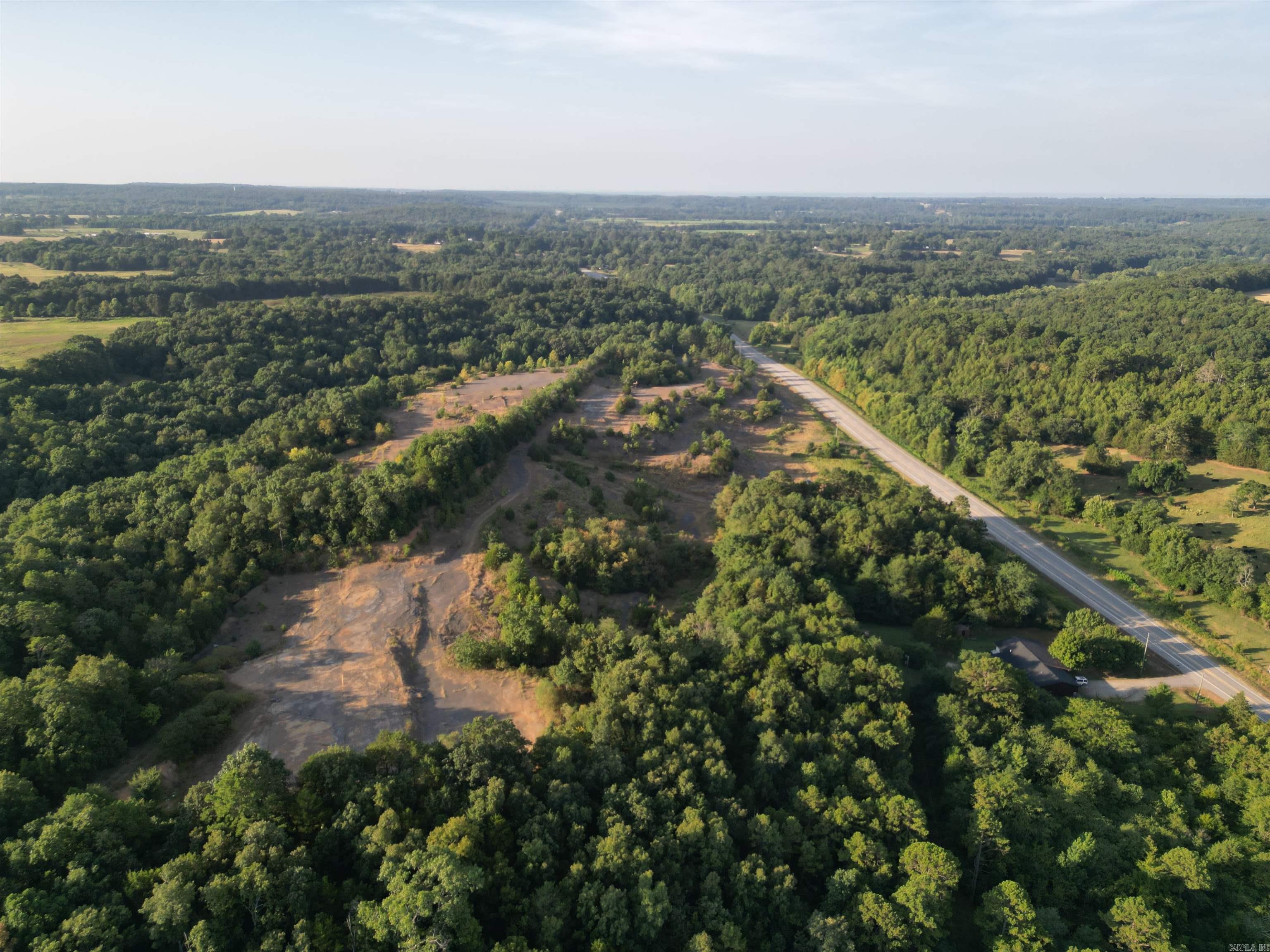 Incredible 90-acre tract located at the main intersection of Rose Bud, Arkansas an unmatched opportunity for commercial development. Featuring a valuable shale pit, and high-traffic frontage, this property offers both immediate utility and long-term investment potential. It borders Sonic and sits directly across from the main service station, placing your business in the heart of Rose Bud's commercial corridor. With size, location, and natural resources, this is a rare chance to secure a cornerstone property in one of the areas most strategic spots.