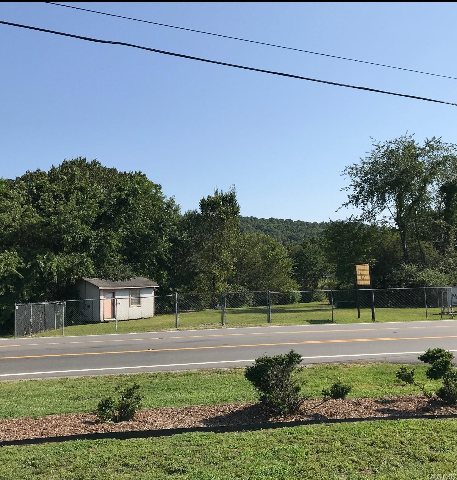 This Commercial lot, .928 acres, is located at a busy intersection with high traffic volume, offers immense potential for business success. The increased visibility and accessibility make it an attractive prospect for various enterprises, enduring a constant stream of potential customers passing by. Whether you are looking to establish a retail store, restaurant or office space this prime location is bound to attract attention.