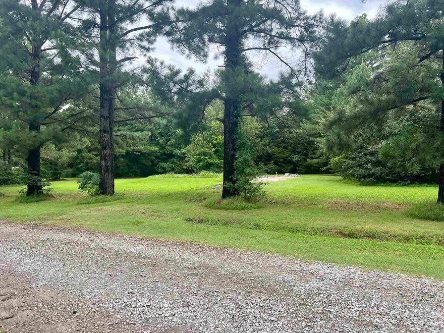 1 acre tract with utilities. Slab from previous home on property, city water, septic in place, electric and gas available to connect. No mobiles, mineral rights do not convey. 1200 minimum build deed restriction.