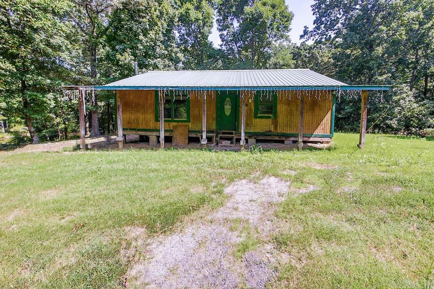 Great rural home and property located on Crowley's Ridge in St. Francis County, AR. This home is 1280 +/- sq ft with 2 bedrooms, 1 bathroom and a large great room with a wood stove. The property features 10+/-acres of land with a pond, barn with a loft, and a chicken coop with a fence surrounding it.