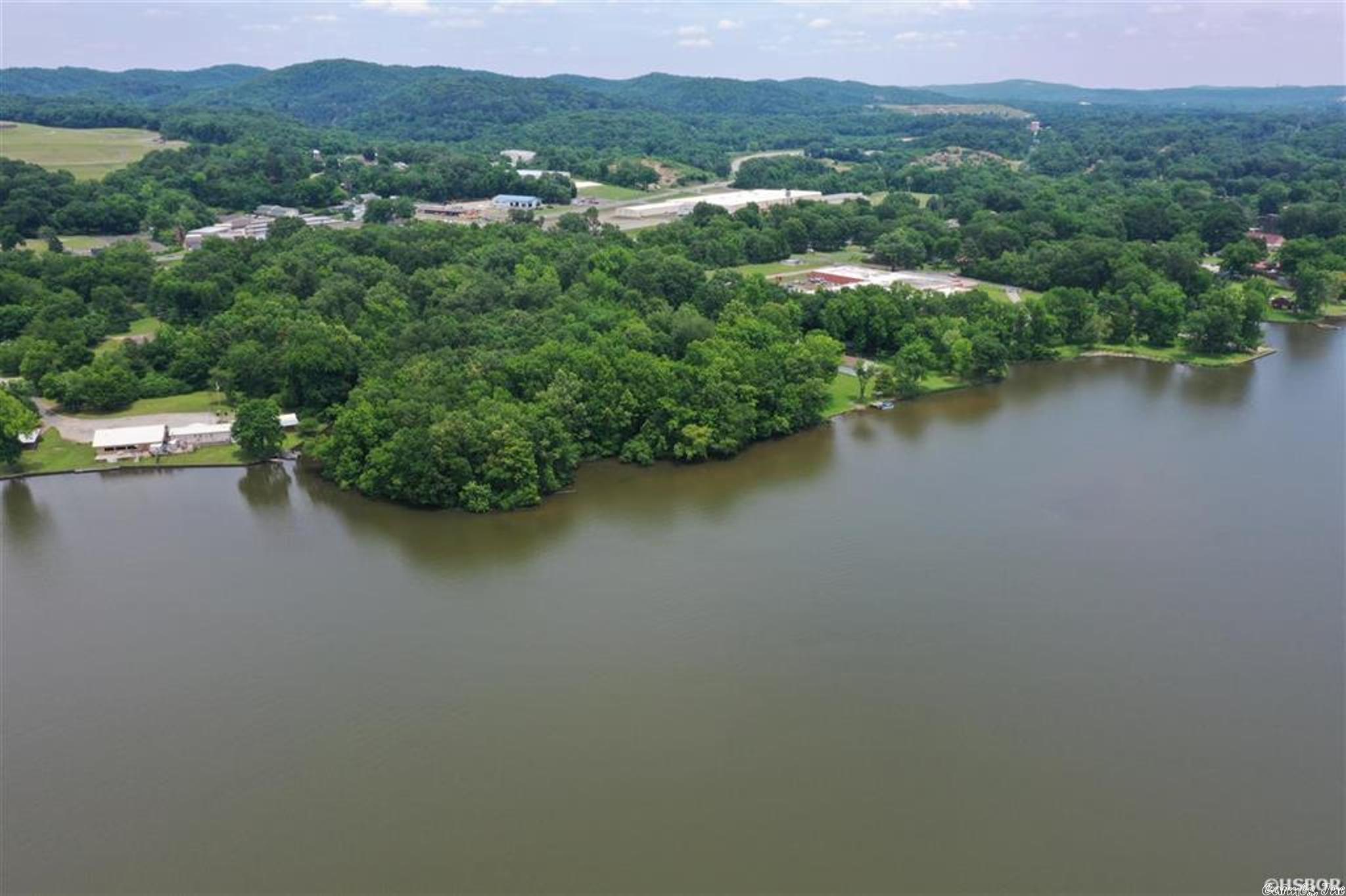 Beautiful Waterfront Peninsula ready for new owner! All utilities are in the street. Over 1,300 feet of waterfront. Essex Park and Lakeside Country Clubs are close! Roads on both sides! Fantastic site for an upscale RV park, mobile home park on the lake, Campground! Let your imaginations soar! Widest part of Lake Catherine makes for fantastic vistas. Owner Agent