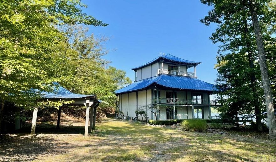 Unique 4 level oriental style lake front home nestled in a private country setting on Lake Hamilton. Home features 3 bedrooms, 3 full bathrooms, 2 partial bathrooms, central cool, central heat, two kitchens, covered parking, open porches, wood deck, boat dock with decking, detached patio covered structure and well house. HUD Case #031-389147, FHA Financing: IE (Insuired Escrow) Property is sold in as-is condition, no warranties, guarantees or representations.