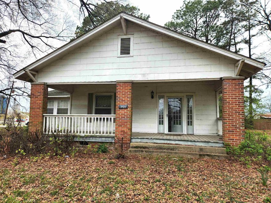 Take a look at this opportunity! This unique, older home, has everything you are looking for! Two bedroom with room for a third, large master suite with large bath and its own fireplace, large kitchen with enough room for an island, two fireplaces, beautiful front porch, two car carport and a large tree shaded corner lot! Bring you tools and make this home your dream home! Agents read confidential remarks!