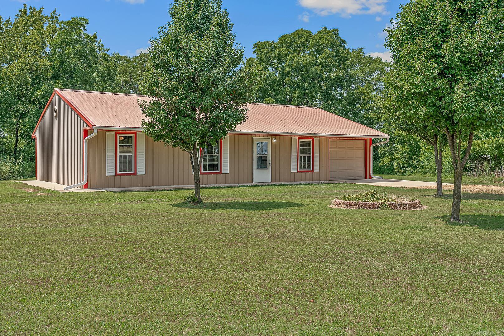 Charming 2-Bedroom 2 bath Home on 1.2 Acres in Harrisburg. Built in 2015, this 1,500 sq. ft.home offers comfort, efficiency, and space. Featuring a durable metal roof and stainless steel appliances, and breakfast bar that blends style with practicality. Enjoy the benefits of well water, plus city water for flexibility and reliability. Situated on 1.21 acres, there's plenty of room for gardening, recreation, or simply soaking in the peaceful setting.This property also has 2 septic tanks and 2 pecan trees, and located on a dead end road. Don't miss this well-maintained property just minutes from town. Call your favorite realtor to schedule a private showing.