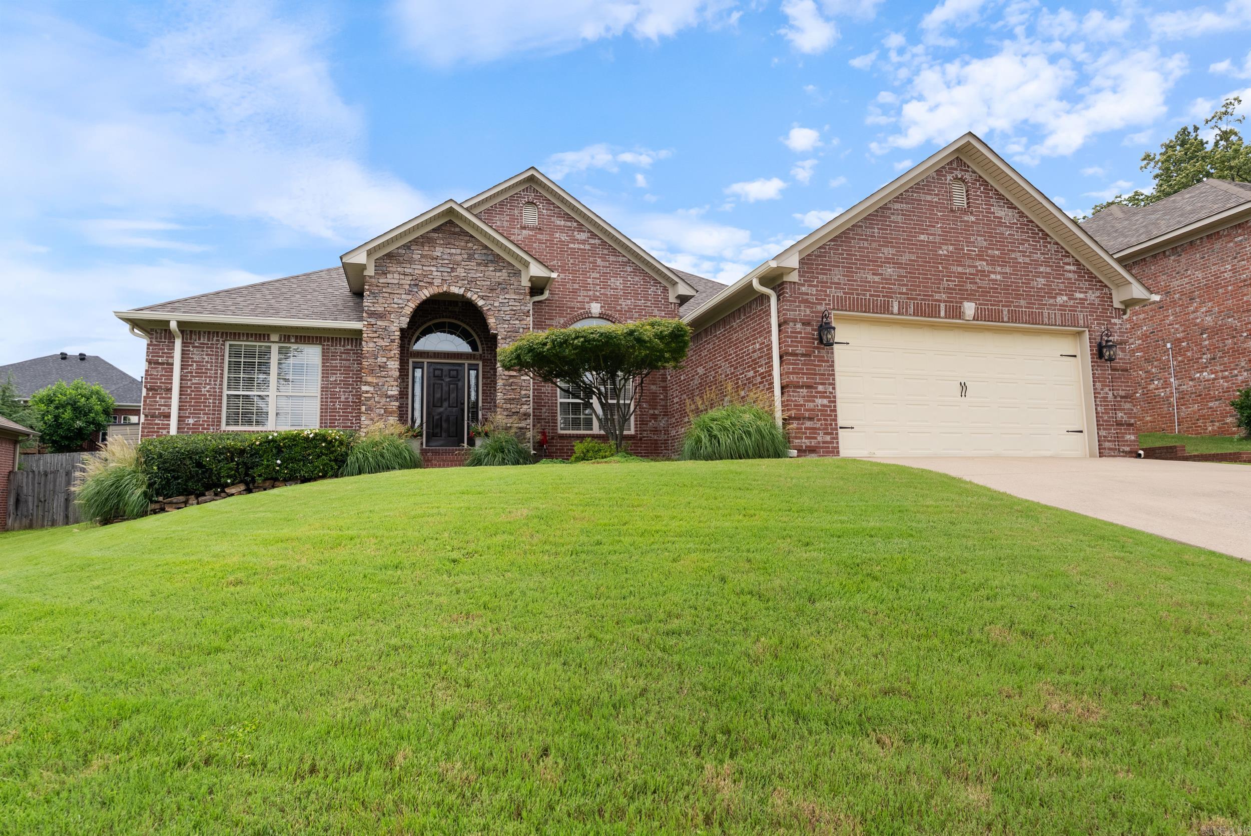Immaculate Home with Updates! This spacious home offers 4 bedrooms, 3 full bathrooms with a large office and is located in the desirable Maumelle Valley Estates with quick access to Maumelle Blvd! Step inside to tall ceilings with crown molding, an open-concept layout, cozy fireplace, and a chef’s kitchen featuring granite countertops, stainless steel appliances, wood cabinetry, under-cabinet lighting, breakfast bar & pantry. The oversized garage offers extra storage, and the covered patio overlooks a spacious fenced backyard—perfect for entertaining! The primary suite features two walk-in closets, double vanity, whirlpool tub, and a walk-in shower. Updates include NEW roof 2024, NEW HVAC (2022), NEW water heater (2022), NEW microwave (2022) NEW wood fence (2019), NEW Gutters and downspouts (2024), NEW garage door opener (2024) & springs (2020), NEW primary toilet (2023), NEW LVP floors in bedrooms, NEW interior paint, NEW whole house water filtration system and NEW granite deep single bowl kitchen sink with touch faucet. Fiber internet, alarm system & storage building included! This one checks all the boxes—schedule your tour today! Agents see remarks.