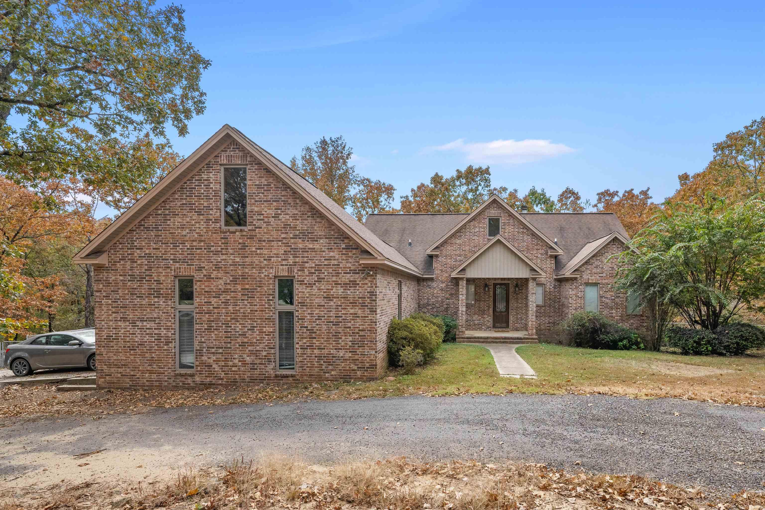 Do you want country living, but less than 10 minutes from the city? Look no further! This custom built home on 5.09 ACRES is perfect for a huge family! with 5 bedrooms, 3 & 1/2 bathrooms, and 4182 square feet, there's PLENTY of room for everyone! 3 stories, Multiple ensuites, and lots of room to relax! With gorgeous wooded views from your solid wall of windows and a lovely back deck, this home is fantastic, alongside having lovely privacy! Large Kitchen and Dining provides room for the entire family! Cabin style living room with SUPER HIGH Ceilings, alongside looking up at the 3rd floor loft space! Downstairs provides it's own Den and laundry room, as well as 2 bedrooms with ensuite bathrooms attached to each! Main floor has primary bedroom and rather large primary bathroom with Walk-in shower and jetted tub! His & Hers Sinks! Half Bath, Kitchen/Dining, Laundry room, & main living area on this floor as well. 3rd floor provides 2 good sized bedrooms and an open loft space for anything your heart desires! Propane used for kitchen stove! and 1st floor laundry is also plumbed for a kitchen if desired! Small section of backyard fenced in for dogs if needed! Call it home today!