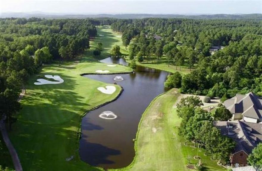 This lot has the best views on the entire course.  A pond with two fountains, the 17th green, and fairway views of 17 and 18 are all visible from your new custom home!  Seller has a survey and 3,500 square foot house plan from local architect and will provide upon request.
