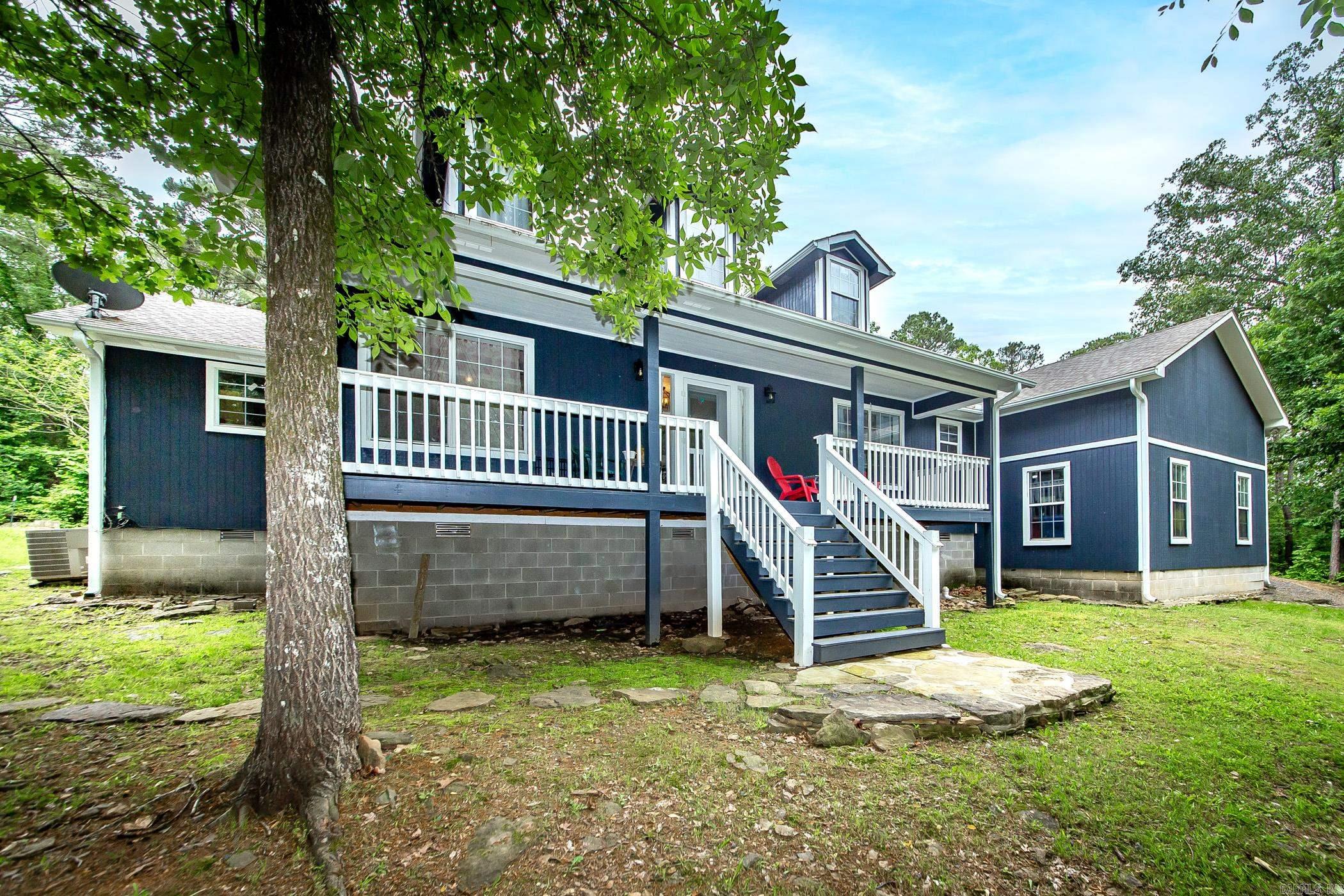This darling Lake home sits on 2 acres at the end of a private road. The secluded and peaceful location of this home provides 3 bedrooms, 2 1/2 bathrooms that have been totally remodeled and updated. The open great room with a large kitchen, island and new appliances allows for plenty of space to entertain. Drink morning coffee in the breakfast area, with an additional area for either living room or dining room also available. The split floor plan features 3 bedrooms and 2 full bathrooms. Upstairs is a large bonus room and half bathroom that allows more room for friends and family. There is even more outside with a firepit, gazebo, as well as a large Shop. Enjoy the tranquil country feel of this home minutes from Greers Ferry Lake. Daytime in the water and night time under the moon and stars is a great way to escape into you own private oasis at Greers Ferry Lake. Call today for your private showing. (upstairs Bonus area and 1/2 bath not included in square footage). Sqft measurement encouraged. Agents see remarks.