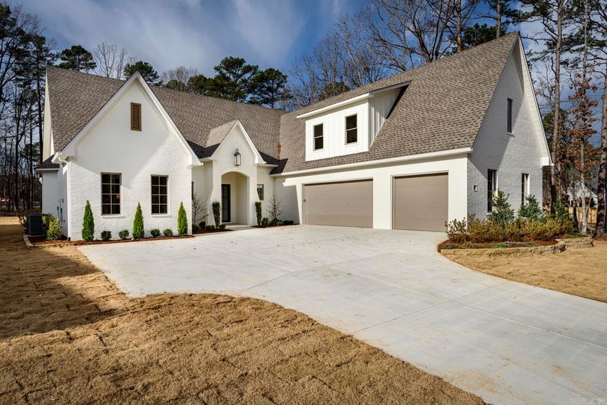 Located in one of Chenal Valley’s newest gated neighborhoods, this newly custom-built home by Hartness Construction showcases exceptional quality and timeless design. A striking foyer opens to a spacious great room with fireplace, flowing seamlessly into a designer kitchen featuring a prep kitchen, butler’s pantry, and food pantry—perfect for entertaining and everyday living. The dining area just off the kitchen features a custom accent wall and overlooks the private backyard and green space beyond. All bedrooms are en-suites, offering comfort and privacy throughout. The luxurious primary suite includes a feature wall, spa-like bath with soaking tub, walk-in shower, private water closet, and dual built-in walk-in closets filled with natural light. Double French doors open to a large, covered porch with fireplace. The main-level guest suite offers a custom bath, walk-in closet, and views of the rear garden. Upstairs includes two additional guest suites and a large playroom or multi-purpose space. Additional highlights include a three-car garage and superior craftsmanship from a builder with over 50 years of excellence in Central Arkansas.