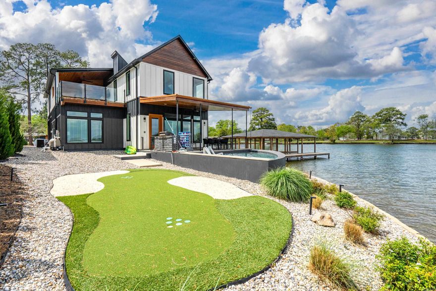 Sapphire Point - Enjoy lakefront living on Lake Hamilton in this exceptional 4-bedroom, 4.5-bath residence that blends modern design, comfort, and recreation. Thoughtfully designed with open-concept living in mind, the home features a fully equipped kitchen that flows seamlessly into expansive living and dining areas—ideal for both everyday living and hosting.  Each bedroom is generously sized, including a distinctive bunk room with four queen beds, while the remaining suites offer king accommodations for added privacy and comfort. The interior is complemented by a dedicated game room featuring air hockey, arcade games, and shuffleboard, creating an engaging environment for leisure and entertainment.  Outdoors, the property continues to impress with a heated pool, fire pit, and a spacious balcony complete with a gas grill and sweeping lake views. Additional features include cornhole and oversized outdoor games, along with direct lake access and the inclusion of kayaks and paddleboards.  This is a rare opportunity to own a premier lakefront home offering style, entertainment, and breathtaking views on Lake Hamilton.