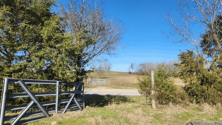 6.02 acres on Highway 298 east at Story AR. This unrestricted parcel has a building spot with a view of Sandlick Mountain. The meandering Cedar Creek runs along the south border. It is partially fenced. A well and septic will need to be installed. Power is along the highway. Mineral rights do convey. Only four miles to Irons Fork Recreational Area on Lake Ouachita or 3 miles to Cedar Creek ramp. And it is a short distance to Ouachita National Forest. Listen to the creek run, the frogs holler, and enjoy this peaceful setting. Call today for a showing.