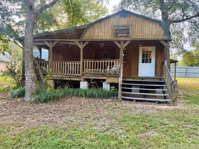 Looking for the perfect blend of comfort, functionality, and country charm? This cozy 1-bedroom, 1-bath home offers peaceful living on 1.11 acres, just minutes from Lake Overcup, I-40, shopping, and dining. Inside, the open floor plan features the kitchen, dining, and living area for a simple living experience, while the versatile loft provides extra space for storage, hobbies, or a flexible bonus area. Step outside to enjoy the covered porch—perfect for relaxing, dining, or entertaining guests. The property also includes excellent storage and workspace options: • 36x40 detached building—ideal for vehicles, boats, or collectibles • Two shops with electricity—perfect for projects or hobbies • Two large carports—extra covered parking for convenience Whether you are starting a homestead, downsizing, or seeking a quiet country escape, this property is full of potential. Opportunities like this do not last long—schedule your showing today!