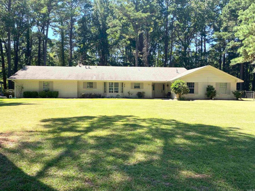 Here we have a beautifully maintained & updated home that is ready for new owners! This 4 bed 2.5 bath is situated in the heart of Ashdown. It has a level lot that is adorned with several mature trees to provide shade and the back yard has been enclosed with chain link fence. The home features two living areas, a formal dining room and a spacious kitchen that is directly beside a breakfast area. The kitchen has modern cabinetry with butcher block countertops and tile backsplash. The vinyl plank flooring that is found in a large portion of the home appears to be in "like new" condition, which is just another indication of how well this home has been taken care of. The master bedroom is large enough to be considered a suite and has its own private bathroom as well. The property also includes a two car garage that has built in storage and a carport awning that will convey with the sell of the home. Schedule your showing today so that you can see it for yourself!