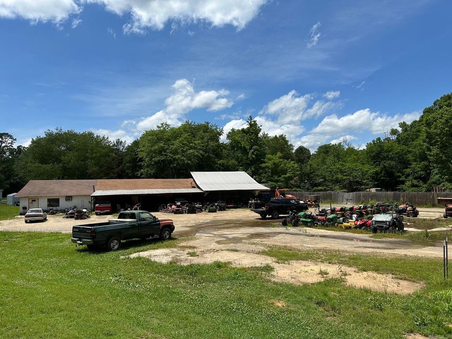 Locate Locate Locate! Have you ever wanted to own your own business?  If so  this is the place for you.  Great location with over 500 Feet of highway frontage.  Existing business is a very successful small engine repair business.  With this location the possibilities are endless.   Two separate lots for a total of  2.5 acres.