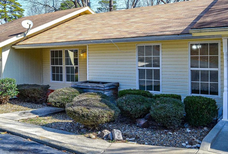 Two-level townhome offering low-maintenance living in a convenient setting. Interior paint and updated flooring create a clean, refreshed feel throughout.  The main level features an open living area with updated laminate flooring and a refreshed kitchen with painted cabinetry, updated countertops, and modern fixtures. The home offers three bedrooms, two full baths, plus a flexible bonus room ideal for an office or additional living space.  Recent improvements include a new 25-year architectural roof (installed February 2025). Private decks provide great outdoor space for relaxing or entertaining.  Additional features include a separate laundry room and extra storage area for added functionality.  Move-in ready and thoughtfully improved—ideal for full-time living or a second home.  Agents kindly see Agent remarks.