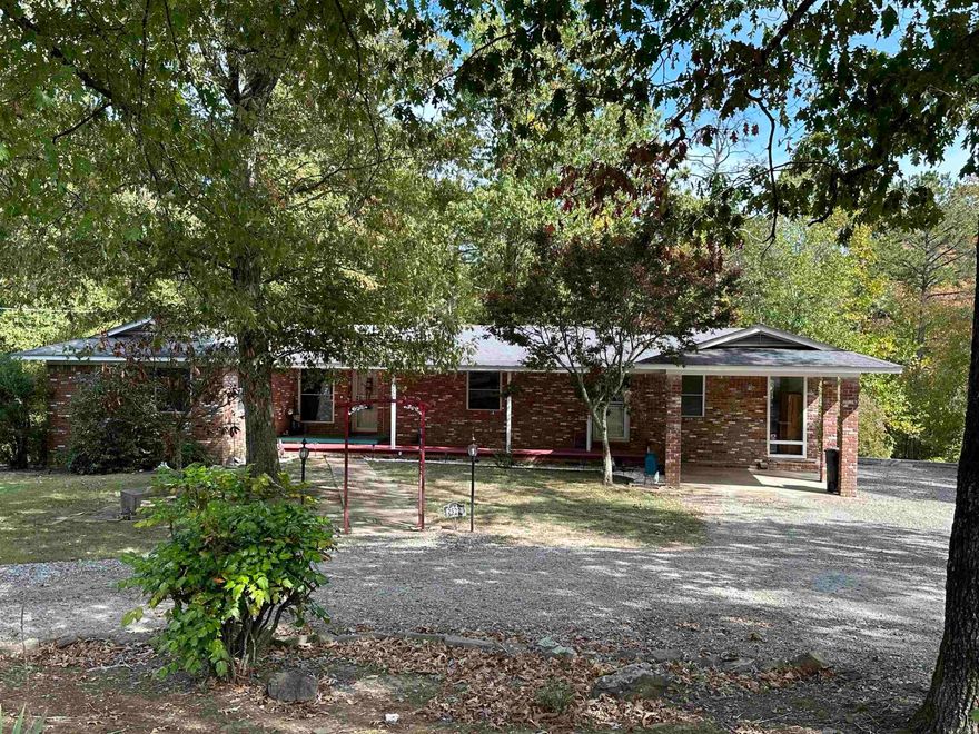 Nature Lovers Dream! Are you looking to find solace on a secluded private piece of land outside of the city limits? Look no further! This property boarders 50 acres of Potlatch-Deltic Timber and 100 acres of the National Forest behind that. This home has a large Living Room/Kitchen with beautiful wooden ceilings. 3 Bedroom 2 Bath home with a finished Basement that could be used as a Man Cave, Office, or Extra Room. House sits on 1.45 acres and has multiple outside storage buildings. You can sit on the large back porch and enjoy watching deer and turkeys in your very own back yard. Priced to sell...Hurry!