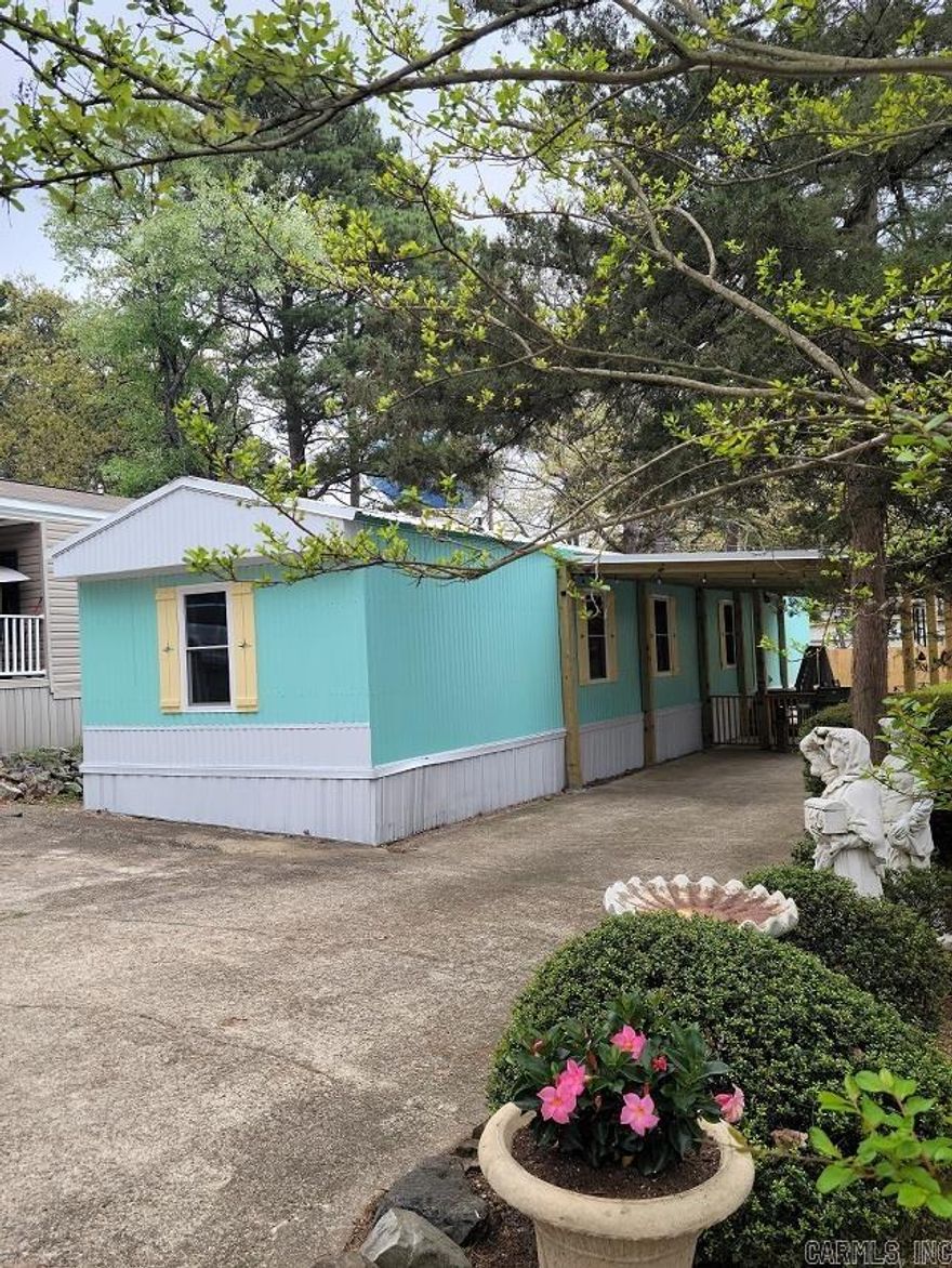 This won't last long at this price!!! Don't miss this rare opportunity to own a newly renovated retreat in hub of Hot Springs National Park!!  Step inside to find a unique living experience with this quaintly remodeled manufactured home, nestled in the historic Timbercrest,"55 and older," Mobile Home Park. Seamlessly blending modern comfort with timeless character. Embrace the past while enjoying the convenience of being only minutes from everything Hot Springs has to offer, including Oaklawn Casino and Racetrack, shopping and restaurants in Downtown Hot Springs, lakes, golfing and more.  All New!! HVAC, roof, carport, water heater, privacy fence, insulated windows, kitchen upgrades, carpet, light fixtures, and newly painted inside and out!! Call for your showing today!!