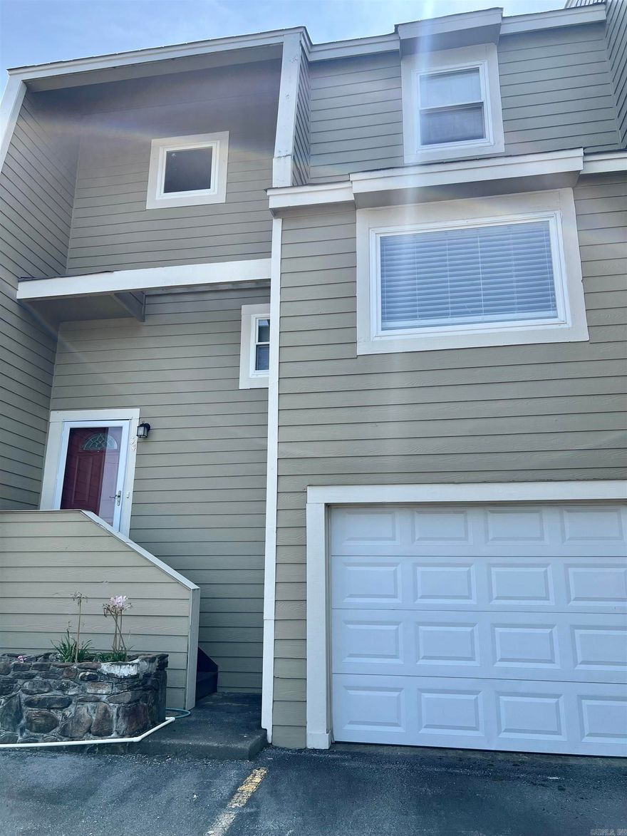 FURNISHED condo in convenient location!  Gated community with pool.  Home features 3 bedrooms, 2.5 baths,  1 car garage + 1 parking pad.  Upstairs bedroom with walk out balcony.  Solid surface counter tops and vinyl flooring throughout.  Home sold AS IS. See agent remarks.