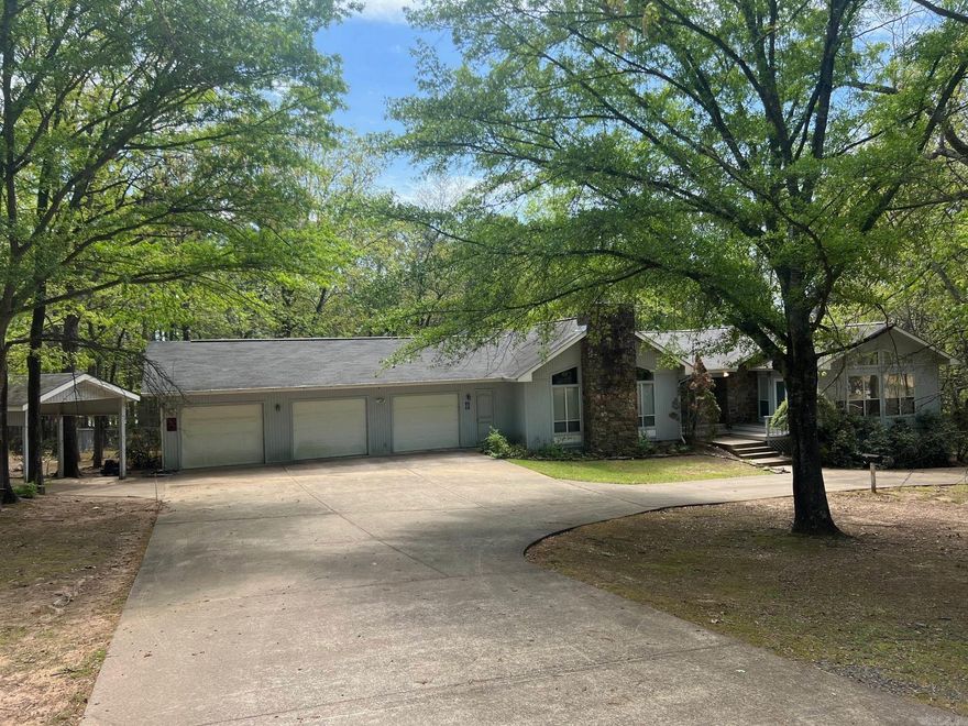 Wonderful home with 5 acres (3 lots), 4 bedrooms, 2.5 baths, nice fenced area for dogs, boat carport, 3 car garage, carport, beautiful setting in an very nice neighborhood near the lake.  Home has a bonus room that could be nice office or sunroom, 2 fireplaces, double oven, breakfast bar nice deck across the back and wildlife galore!  Don't let this dream home pass you by.