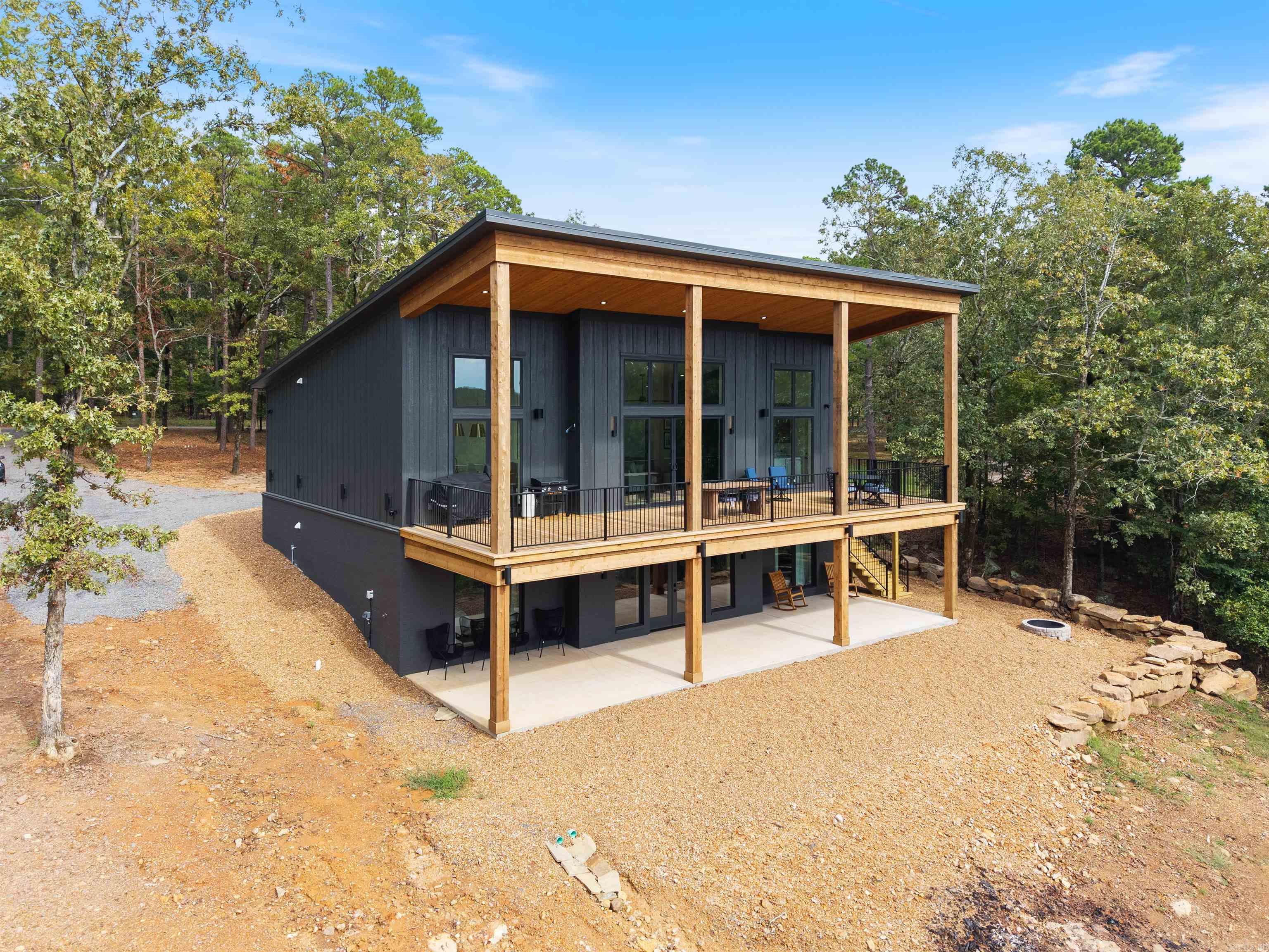 Don't wait to checkout this Stunning Custom Built Lakefront Home, tastefully FURNISHED that also includes all appliances, tv's, etc. with 12'-15' ceilings throughout the kitchen/living room areas, walk in-pantry w/drink cooler & microwave, double oven, plenty of windows to capture the lake views of Greers Ferry Lake, white oak custom cabinets (built by the well known "Henegar Cabinets", home built by Bridgbilt Builders), Quartz countertops throughout w/exception of the leathered granite countertops in the Primary Bathroom, 4 bedrooms, 3 full baths, 10ft. ceilings in the bedrooms upstairs w/8ft. tall solid wood doors, 9ft. ceilings downstairs w/walkout basement, 2nd living/gameroom area downstairs, built in bunkbeds that sleep 8 people in one room, surround sounds speakers (inside & out),security system installed, 12x40 Utility room w/side load garage, Seamless Metal Roof, Fiber Optic Internet through "Connect2First" & more ! See "documents" online under "docs", taxes TBD, & also checkout the links for Video & Walkthrough tours.