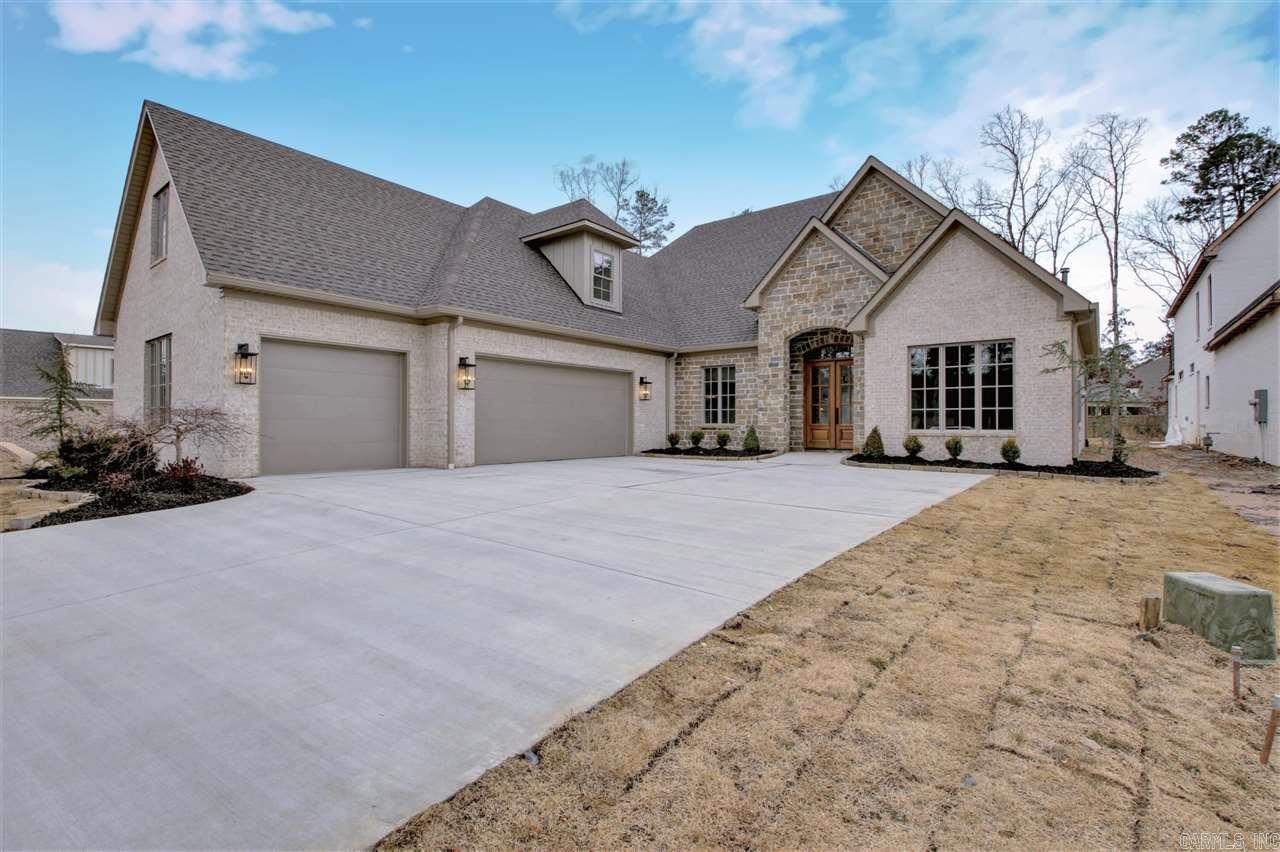 Nestled between Chenal CC's Bear Den & Founders golf courses, this stunning new Randy James construction features 4 bedrooms, 3 full & 2 half baths, office w/vaulted beamed ceilings, large game room + 2 bonus rooms w/ options to convert into 5th bedroom, home gym, 2nd office or storage. Pool worthy flat 1/3 acre lot with xtra deep 3 car side load garage. Chef's kitchen, butler's pantry, covered patio w/fire place. Highly upgraded in exclusive gated neighborhood w/golf cart access to golf, pool, tennis, club