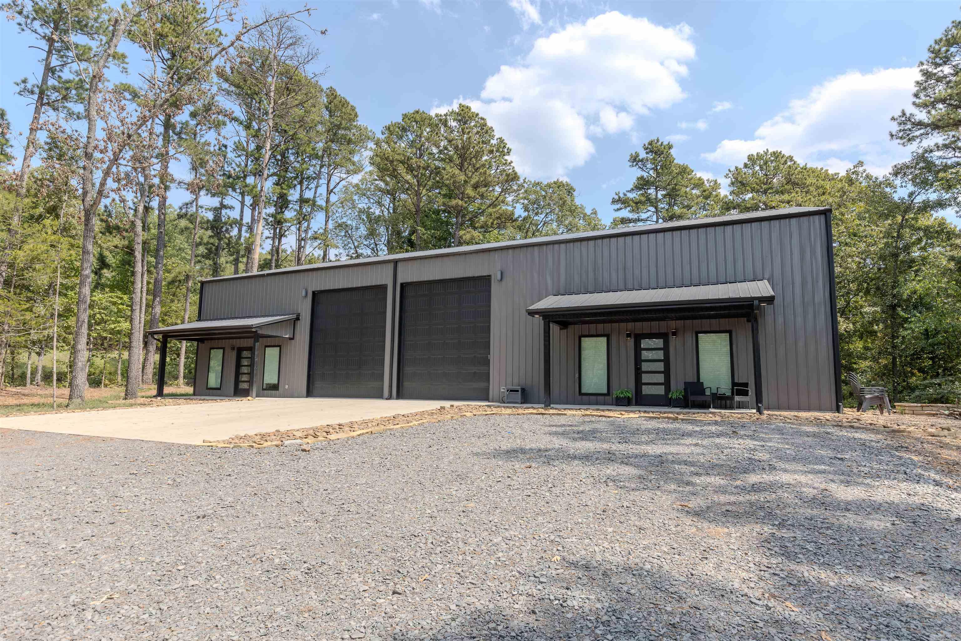 This remarkable new construction is unlike anything you can find on the market!! Pulling into the driveway, you will see Greers Ferry Lake. This home is setup as a duplex and has 2 separate living quarters with a shared garage space that is heated and cooled. The right side of this home features 4 bedrooms, 2 bathrooms and an office/gameroom! There is LVP and quartz throughout, with a walk-in pantry showcasing a second refrigerator and ample storage. Enjoy the 85 gallon marathon water heater that services this side. The left side features 2 bedrooms, 2 bathrooms! Matching LVP and quartz is carried throughout this side of the home. The shared shop space features 2 12x14' garage doors - enough space to store your RVs or boats! You can also enjoy the 50 amp RV plug on the front. This garage space is heated and cooled. Additionally, there is extra storage space at the back of each home. The right side is plumbed for an ice machine! The entire home features walk in attic access, spray foam insulation for great energy efficiency! Rent a boat slip at Furgerson's Choctaw Marina, which is a close .7 miles from the property. Rented out on AirBnB currently.