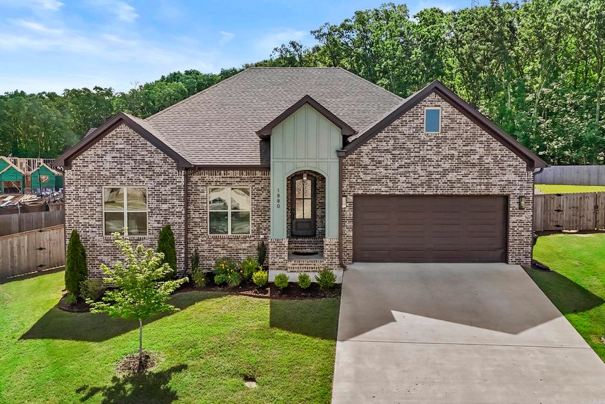 Built in 2024 and looking brand new, this stunning home, with upgraded finishes is a better built home by Tom Watson. Home is nestled on a quiet cul-de-sac in a highly desirable neighborhood, with easy interstate commute and proximity to points of interest, making this location ideal. Inside, you'll find 4 bedrooms, 2.5 baths, and a spacious, open layout with white trim, versatile warm off-white paint, faux wood blinds, and dark wood-look tile flooring throughout, making a lovely contrast and complementing the design. Home is bright and fresh! The kitchen dazzles with beautiful quartz countertops, white cabinets, a striking backsplash, a new kitchen faucet, and a large pantry. The expansive private master suite is separate from the other bedrooms, offering a large retreat bathroom and a huge walk-in closet. Green features include low-E windows, radiant barrier roof decking, a tankless water heater, and 14 SEER HVAC. Lot has a slight uphill slope offering an elevated view, security and a serene tree-lined backdrop. Outdoors, enjoy a covered porch, patio, a fully fenced yard, a new rocked fire pit area with a Thermacell Live System for mosquitoes. This one-story gem is a must-see!