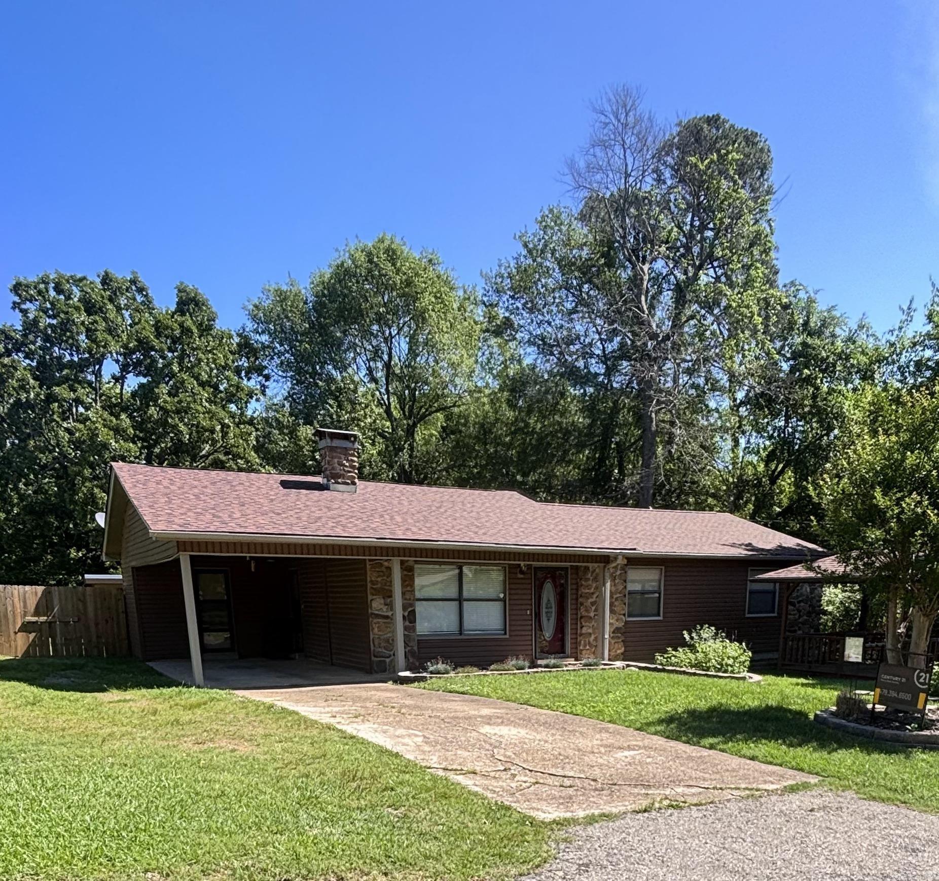 Lovely well-cared for rock and frame home. First time on the market in over 45 plus years! All the upgrades on the exterior, new vinyl siding, new roof on house and outbuildings. Gorgeous landscaping with beautiful flowers. Gazebo out front with electric fan. Inside you have brand new painted rooms, quartz countertops in kitchen, almost new appliances, large living room with cozy fireplace, plus an added bonus room to use as a den or second living space. Privacy wood fence around the back yard. This home is at a fabulous price under $200K. Call for private showing.