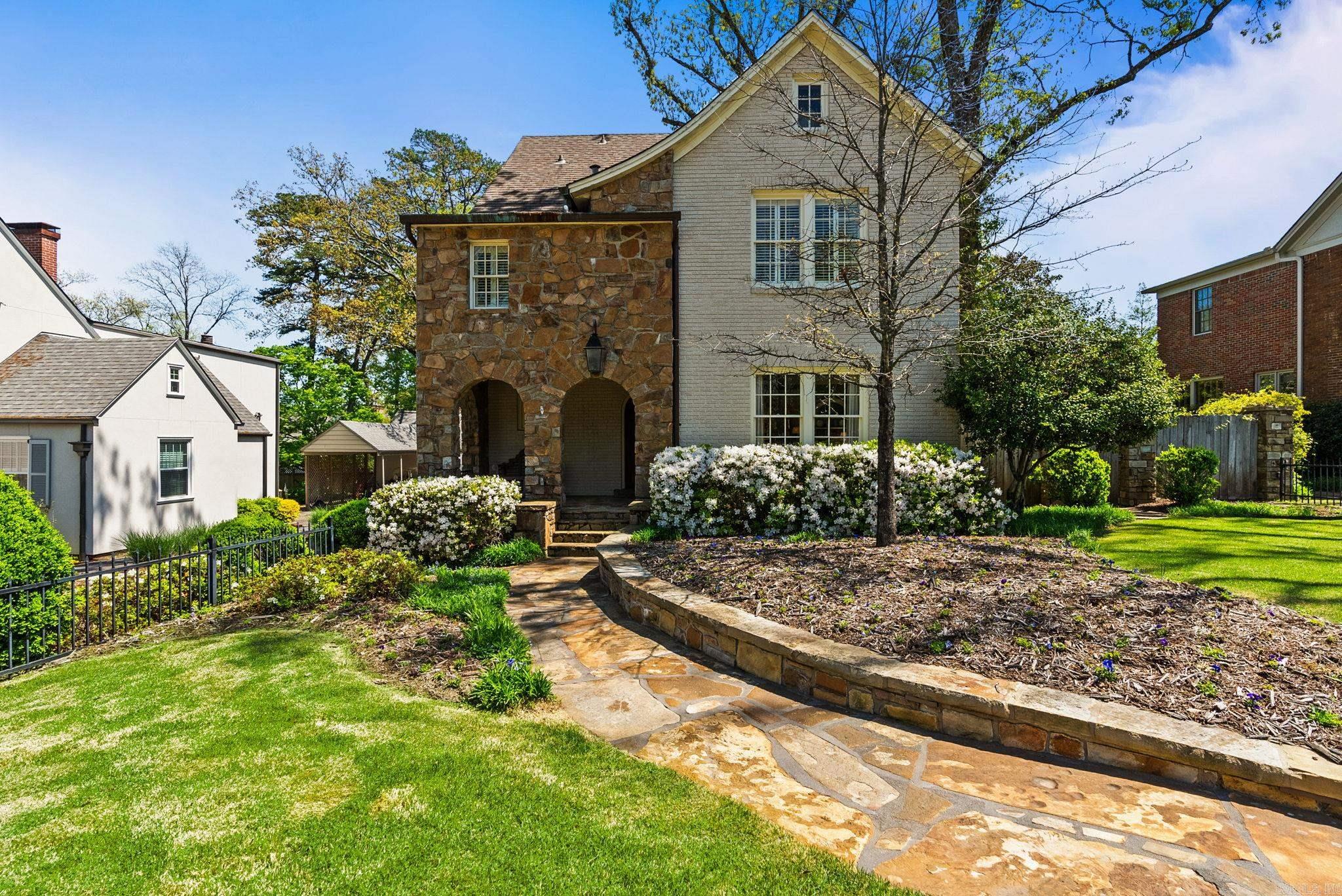 Absolutely lovely Heights Tudor located on a 75 foot wide lot. Large formal living with gas log fireplace to the right of the foyer. Wonderful bookshelves flank the entrance to the dining room. A large family room with vaulted ceiling runs across the back of the house with fireplace. A cozy library / office is also in the back of the house as well as a laundry area and half bath. Beautiful kitchen with stainless appliances and tons of storage. Upstairs are three bedrooms and two full bath on the second floor. Primary bedroom has three closets. Third floor has a full bath off of the bedroom. Gorgeous backyard with two car garage with garage apartment above. A Height classic traditionally updated.