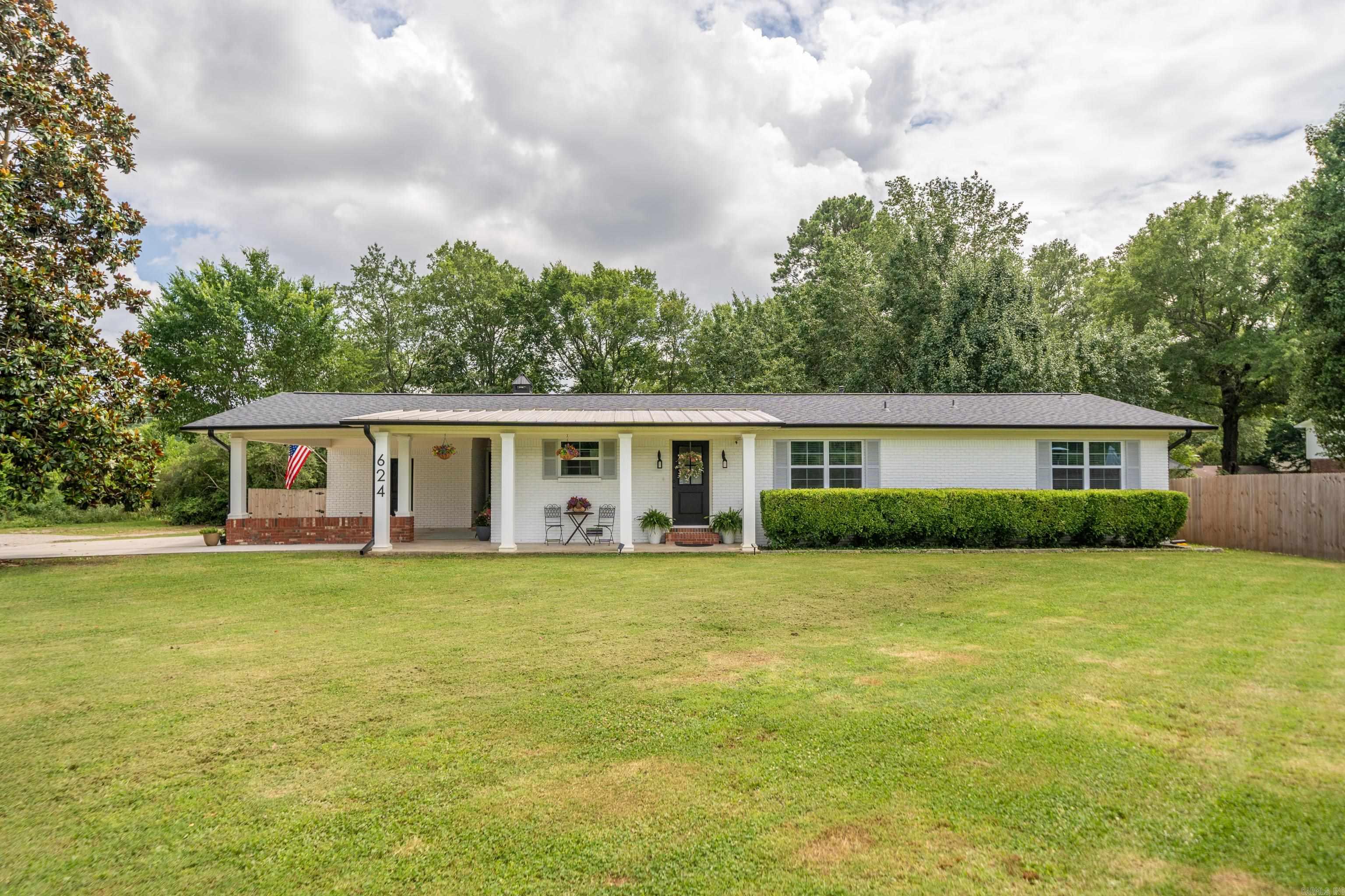 This beautiful one-level home offers the perfect blend of modern living & practical comfort. Completely remodeled with thoughtful attention to detail, this 2,239 sq. ft. residence features 4 spacious bedrooms & 3 full bathrooms in a convenient split floor plan that provides privacy for family members & guests alike. Step inside to discover an open concept design that makes entertaining a breeze. The kitchen sparkles with new appliances & ample counter space, perfect for the home chef or weekend entertainer. Imagine hosting dinner parties that flow seamlessly from kitchen to dining area to living room! The primary bedroom offers a peaceful retreat with an ensuite bathroom that feels like a personal spa. Energy efficiency meets modern convenience with the tankless water heater providing endless hot water while keeping utility bills in check. Outside, the large, fenced backyard creates a private oasis for outdoor activities, pet playtime, or simply relaxing under the stars. Located in desirable Hot Springs, you'll appreciate being just minutes from everyday conveniences like Walmart Neighborhood Market (approx. 1.8 miles away) & quality education at Lakeside School 3 miles away.