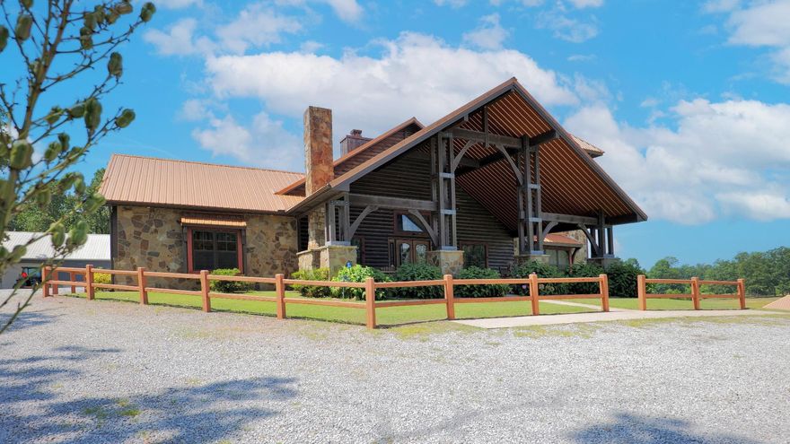 Outstanding lodge style home in the foothills of the Ozarks! This remarkable property features a cedar and stone home with unique features not likely to be found elsewhere on the market! Inside you will find a luxury kitchen with multiple cabinet drawers, ice maker, double oven and granite counter tops, formal dining and breakfast area, 3 fireplaces, 3 bedrooms, 3 baths, a deluxe double length single garage (with game area), and an additional double garage attached! Be sure to invite your guests to stay in the guest suite (detached) which is loaded with rustic charm and beautiful finishes! An added bonus is a pioneer cabin that the owner has moved and assembled on this property to add to the rustic charm and to provide a great man cave/she-shed to relax at in the woods!! An additional bonus is the barn/shop with electricity and 2 overhead doors (approx 30x80 under roof). You will fall in love with the covered porch area with an outdoor fireplace and beautiful view of the pond/lake! All of this on 40 acres of rolling woods and pasture (all fenced and cross fenced) with 2 large stocked ponds. There is great opportunity here for raising livestock and outdoor recreation.