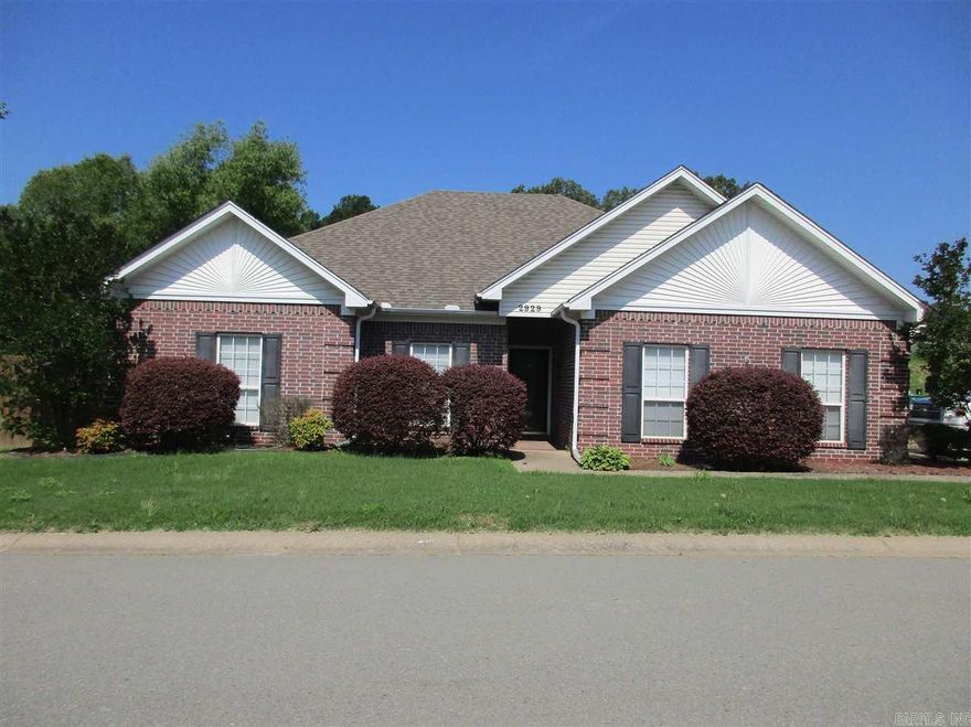 Beautiful home with stained concrete floors and a split floor plan, with a fenced in backyard.