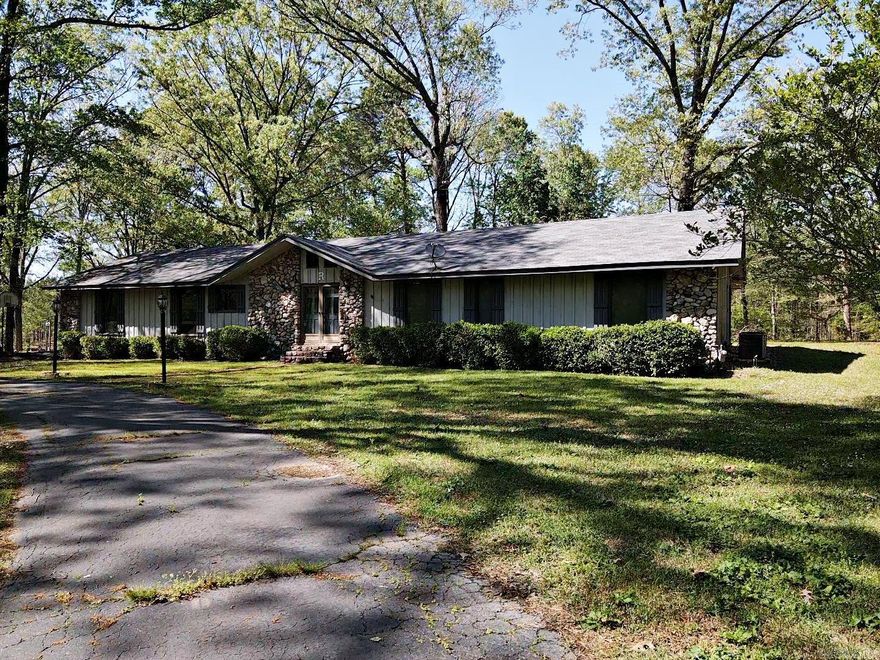 This 3/2 is located in beautiful country setting but yet minutes from all the amenities of town.  The fireplace accents the living room for a cozy setting with a cover patio right outside.  The spacious kitchen flows into the formal dining room and would be a great place for large family gatherings. A large master has an office/workout room right off the master bath. The property is .9 acres with a 20 X 29 workshop, a double car garage, and an asphalt circle drive.  Roof was replaced in 2019. This is one-of-a-kind property in a most desirable neighborhood, call today!