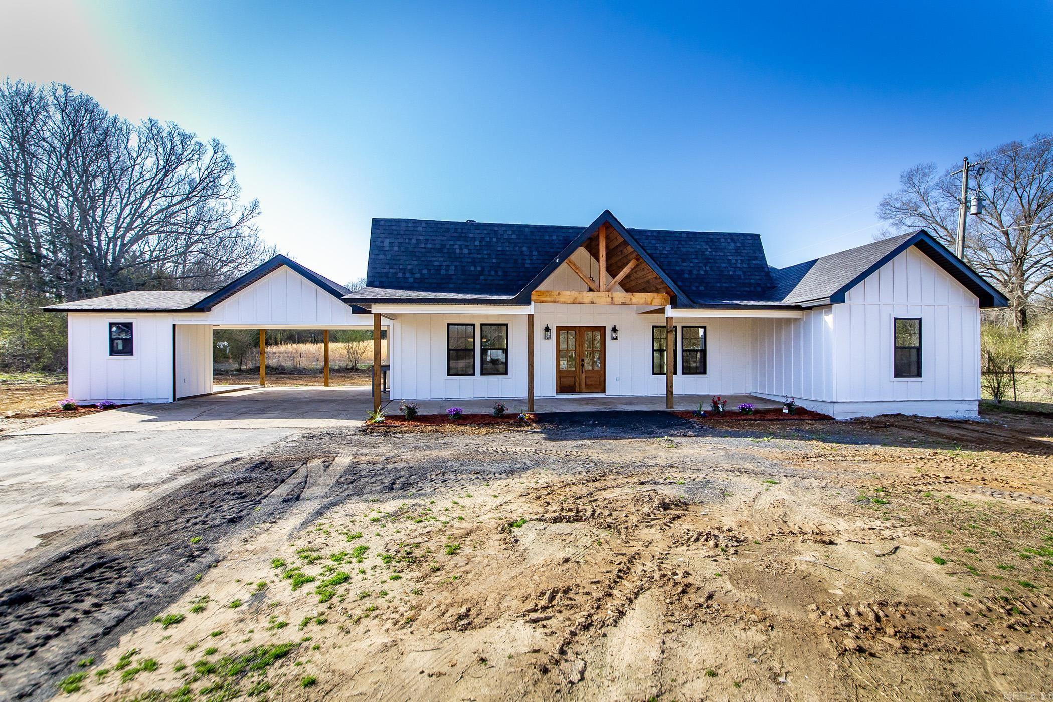 As you pull up, the long driveway welcomes you to this stunning modern farmhouse. The white board and batten exterior, accented with black fixtures and new windows, creates a striking first impression. A large front patio, lined with landscaping, invites you in, while the vaulted ceiling, tongue and groove wood, recessed lighting, and grand double entry doors set the tone for whatās inside. Step into a bright, open-concept space with luxury vinyl flooring, white walls, and recessed lighting throughout. The kitchen features quartz countertops, stainless steel appliances, a spacious pantry, and a large island perfect for entertaining. The main-level primary suite offers a spa-like en-suite with a double vanity and a large walk in closet. Upstairs, youāll find a cozy hangout space, two bedrooms and a full bath. A covered side patio provides the perfect outdoor retreat. Donāt miss this beautifully updated home! AGENTS SEE REMARKS