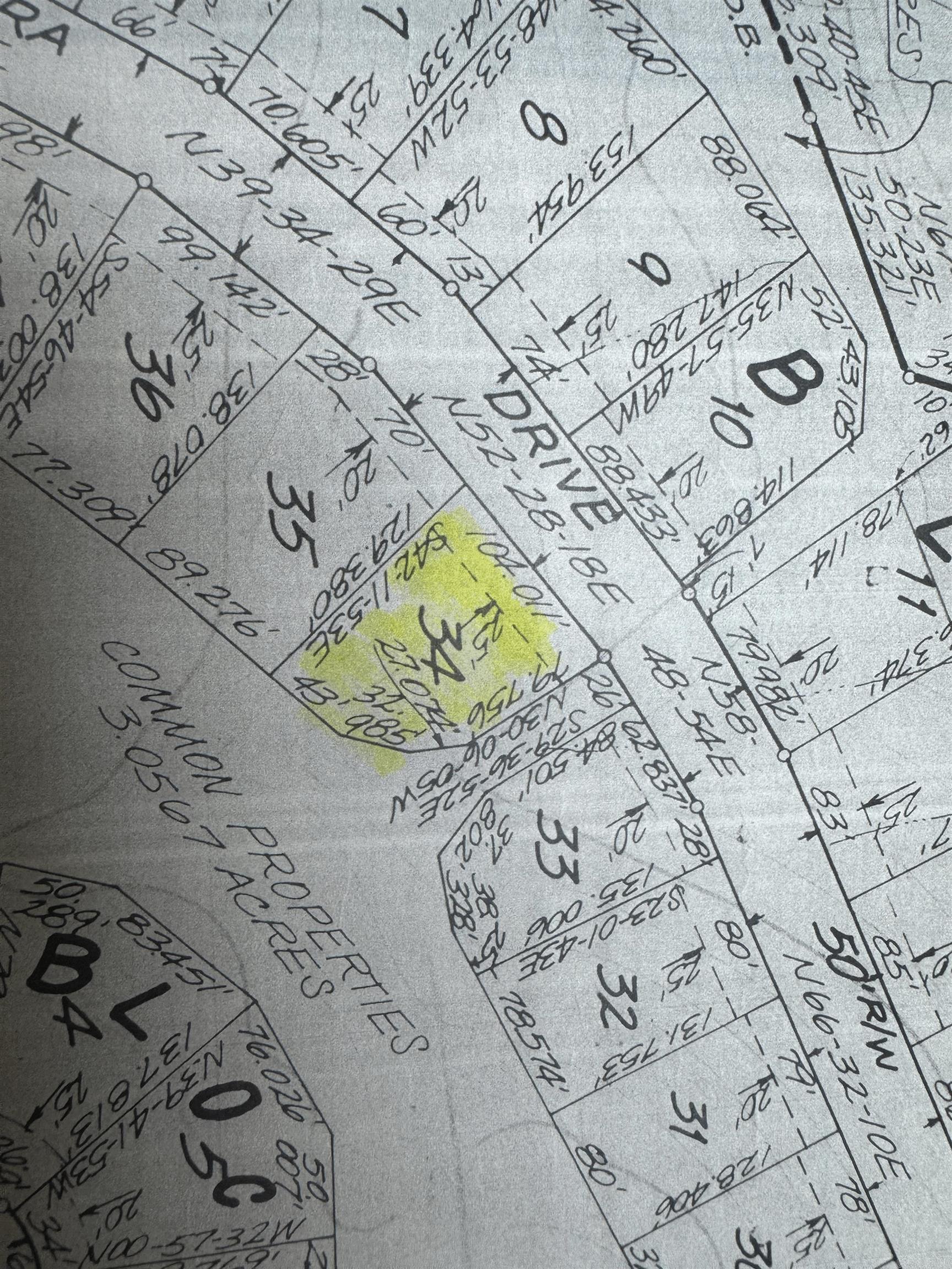 Empty lot on one side, common property to the other side and to the rear.