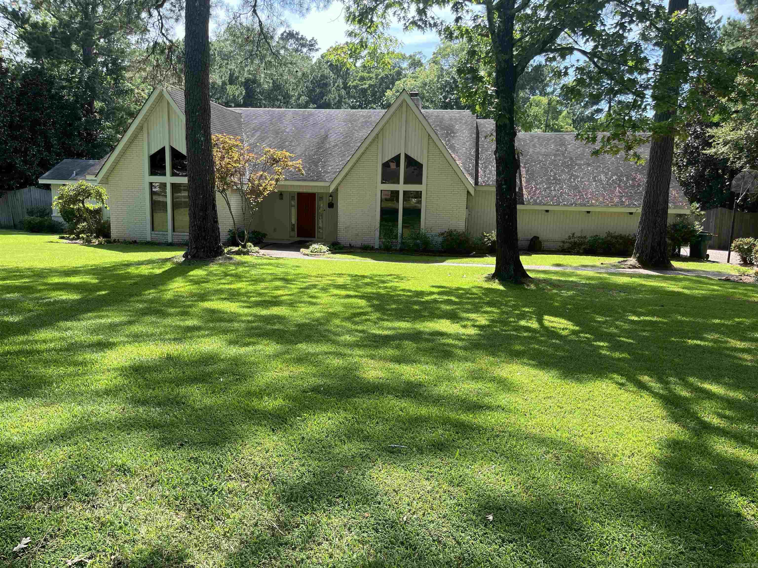 PRICE REDUCED - This 3,788 sq. ft. home is located in the Crestview area. If you want to entertain, this home has it all. As you enter the home you have a breath-taking view of the living room flanked by gas log fireplace and windows overlooking the lush backyard paradise and gunite heated pool and hot tub. The two rock waterfalls offer a pond perfect for Koi fish. To the left of the living room is a large den with a bar and room for a pool table. The eat-in kitchen is equipped with white cabinets, granite countertops, flush lighting and granite back splash. Appliances include a double oven, refrigerator, built-in microwave, a gas range and dishwasher. The breakfast area overlooks the massive, 2,578 square foot, open porch, deck and patio with composite floors and cathedral ceiling. The formal dining room and laundry room are connected to the kitchen. The master suite has a gas log fireplace to snuggle by during the winter and master bath with his and her vanity, jacuzzi tub and walk-in closet. The split bedroom arrangement has two bedrooms with their own baths including large closets, granite countertops and jacuzzi tub. Den could be fourth bedroom with half bath.