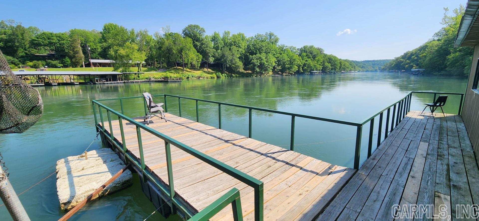 Trout Dock on the Little Red River. Sold before listed. 4 duplex cabins, 16 camps sites with 50 amp service, trout dock 22 slips, 36 boats and small store. Includes some property across the street.