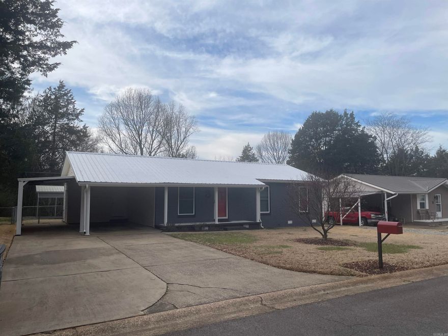 You have to see this, a space that perfectly blends modern updates with a laid-back, rock ‘n’ roll charm. This 3-bedroom, 1½-bath home offers 1,104 square feet of meticulously maintained living space, radiating a vibe that’s both cool and inviting, warm and fun, family and party. Step outside onto the huge covered swinging deck—wired with lighting and fans—ideal for chill evenings or vibrant gatherings. A separate graveled driveway leads to an open-air carport, perfect for storing two vehicles, boats, or even ATV's, and a handy storage building/shop adds even more practical flair. Whether you're a family, student, or creative spirit, this home delivers the perfect canvas for your lifestyle without any over-the-top fuss.  Highlights: stylish & modern walk in shower & bathrooms, incredible backyard covered deck that's wired, lighted, and has fans, additional vehicle or misc. carport in back yard, and backyard hobby & storage shop.