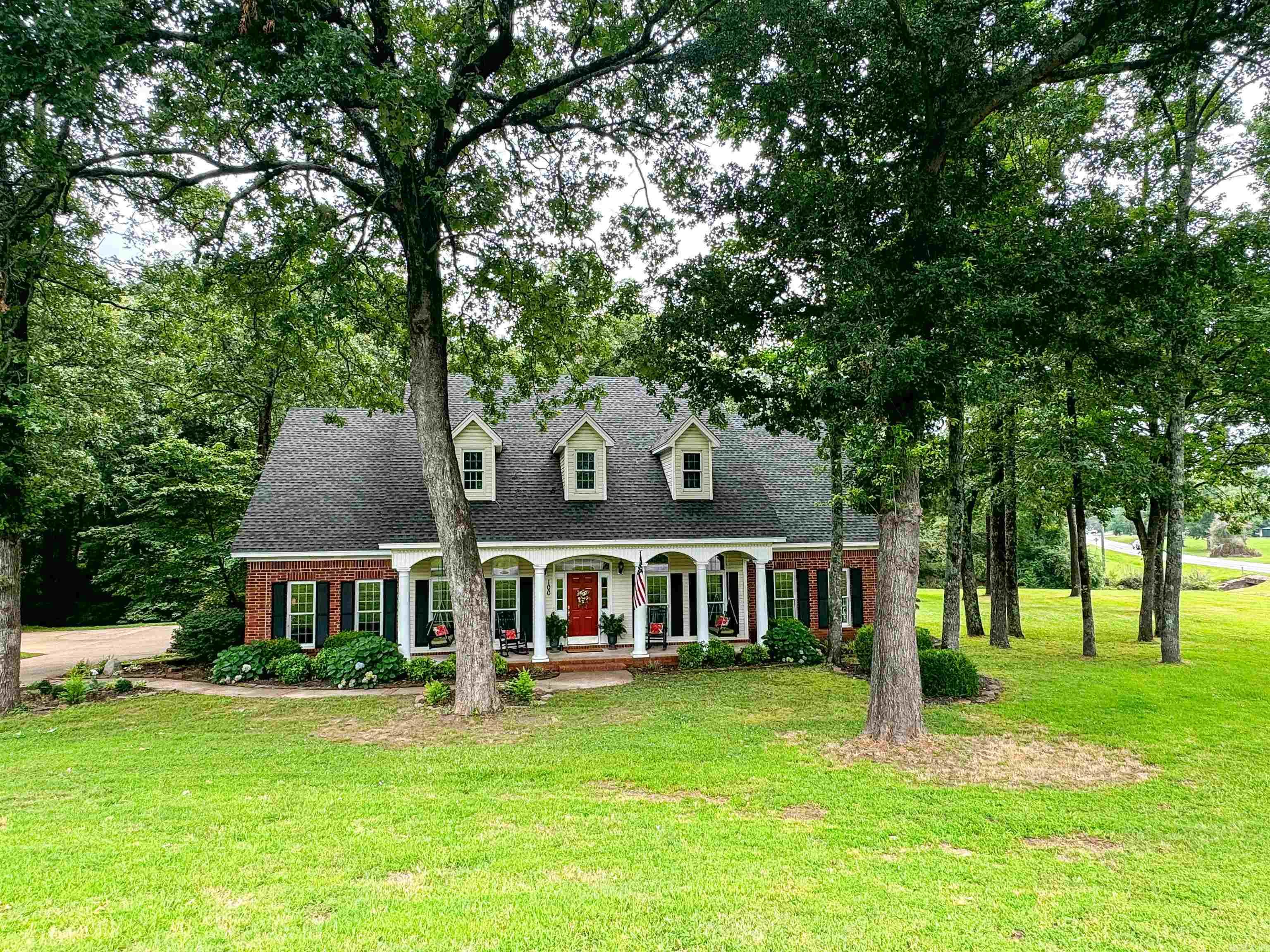 Gorgeous custom-built home on a large lot with a 1500 sq ft inlaw/guest house (2BR/2BA with large dining, spacious kitchen & sunroom) with many updates including new hvacs & roof, as well as luxury vinyl floors throughout. This home is tastefully updated with many great features such as two dining areas, double oven, "sonic-style" ice maker, pantry, quaint sunroom, office with French doors to foyer, large laundry with built-ins and extra counter space for sewing or crafting, bookshelves and built-ins, wood-burning fireplace, spacious primary bedroom suite with room for a sitting area & large walk-in closet. The upstairs features a large bonus/game room, two bedrooms & bathroom plus easy access to great attic storage. Sit on the custom rock patio and enjoy all the meticulous landscape while watching the water gently roll by in the small creek behind the home & roast marshmallows in the fire pit under the trees! Guest house has its own front porch designed to match the main home & features very spacious rooms and plenty of room for entertaining & storage. There are extra parking pads for guests as well as a 2-car garage with a 3rd bay for a mower or golf cart. So Many extras!