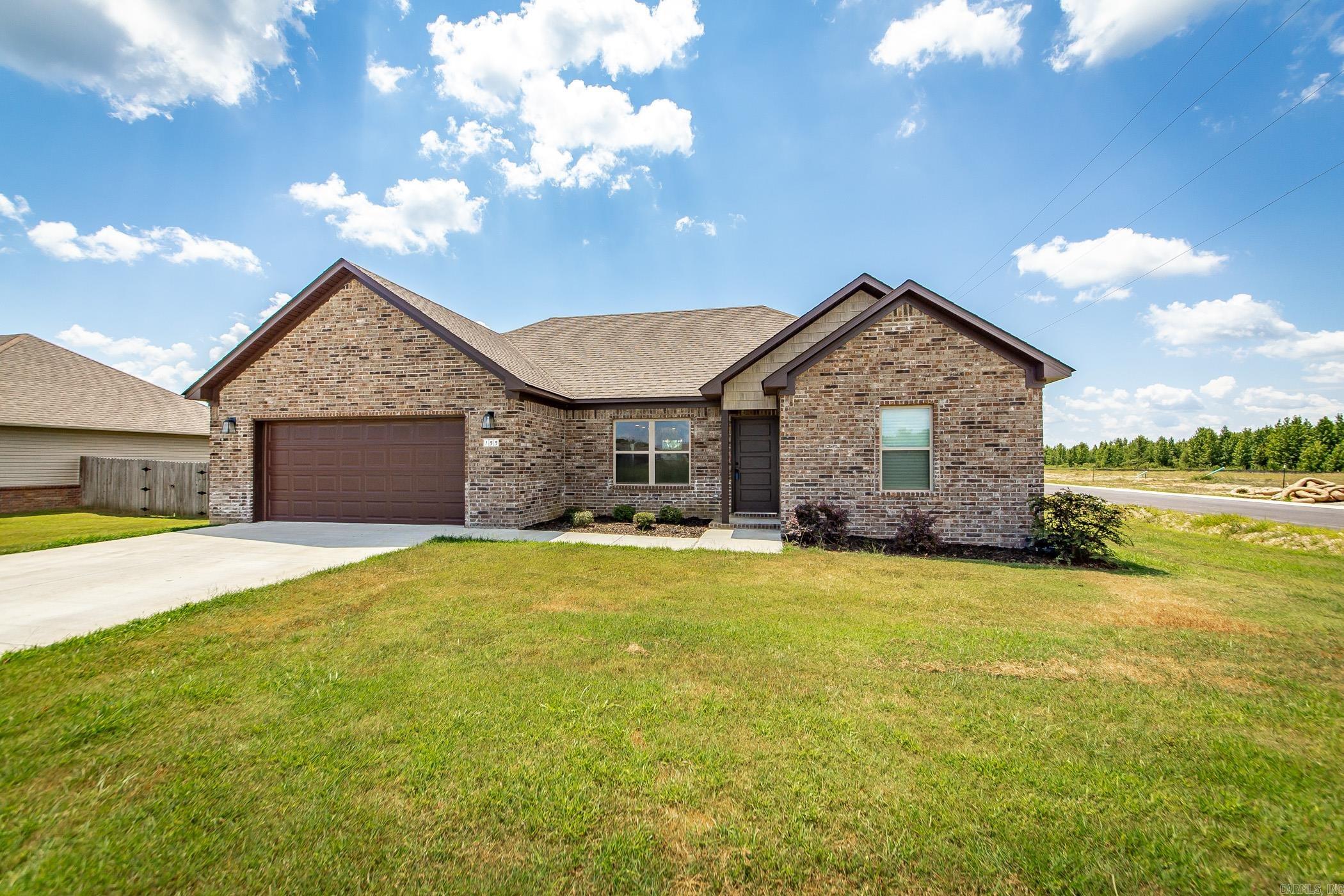 This beautiful all brick home is waiting for it's new owner. This newly built home has all the amities you could ask for. The kitchen is open to the living area and the primary bedroom is split from the secondary ones. The kitchen has granite countertops, stainless appliances, and breakfast bar. The entire home has wood look tile flooring for easy cleaning and maintenance. NO CARPET! Oversized corner lot too!
