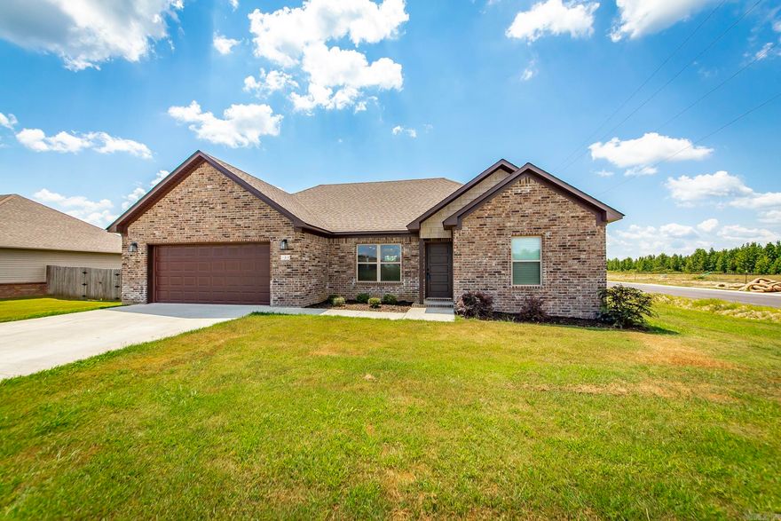 This beautiful all brick home is waiting for it's new owner. This newly built home has all the amities you could ask for. The kitchen is open to the living area and the primary bedroom is split from the secondary ones. The kitchen has granite countertops, stainless appliances, and breakfast bar. The entire home has wood look tile flooring for easy cleaning and maintenance. NO CARPET! Oversized corner lot too!