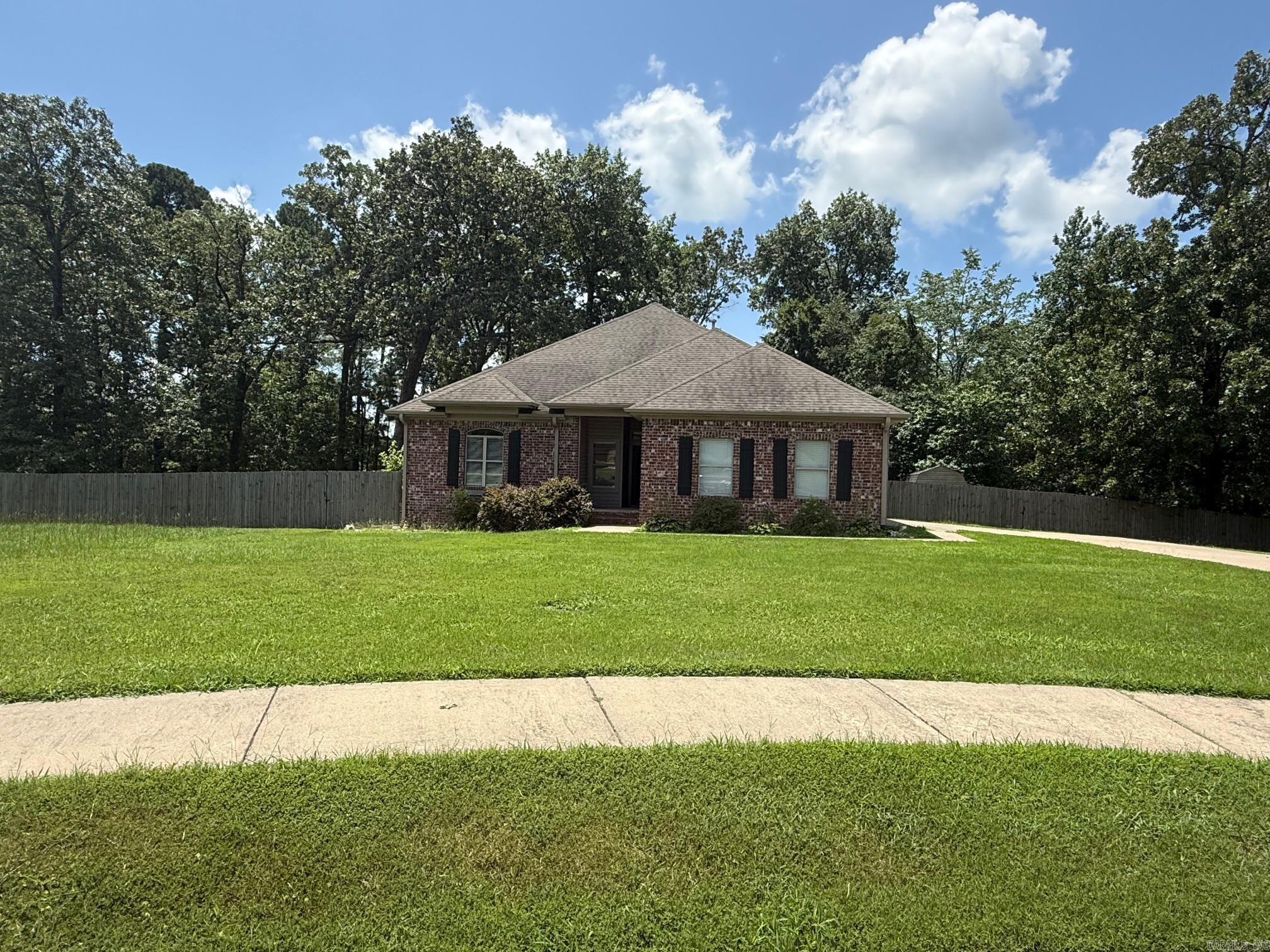 Welcome to 8705 Wingate Drive, a stunning 4-bedroom, 2-bathroom home located in the charming city of Benton, AR. This property boasts a range of high-quality amenities that are sure to impress. The kitchen is a chef's dream, featuring sleek granite countertops and a refrigerator provided for your convenience. The home also includes a spacious garage, perfect for parking or additional storage. Step outside to discover a fully fenced-in yard, offering a private outdoor space for relaxation or recreation. A storage shed is also included, providing extra room for your belongings. The covered back porch is the perfect spot to enjoy your morning coffee or unwind after a long day. With its blend of comfort and practicality, 8705 Wingate Drive is a place you'll be proud to call home. Small dog okay, no cats.