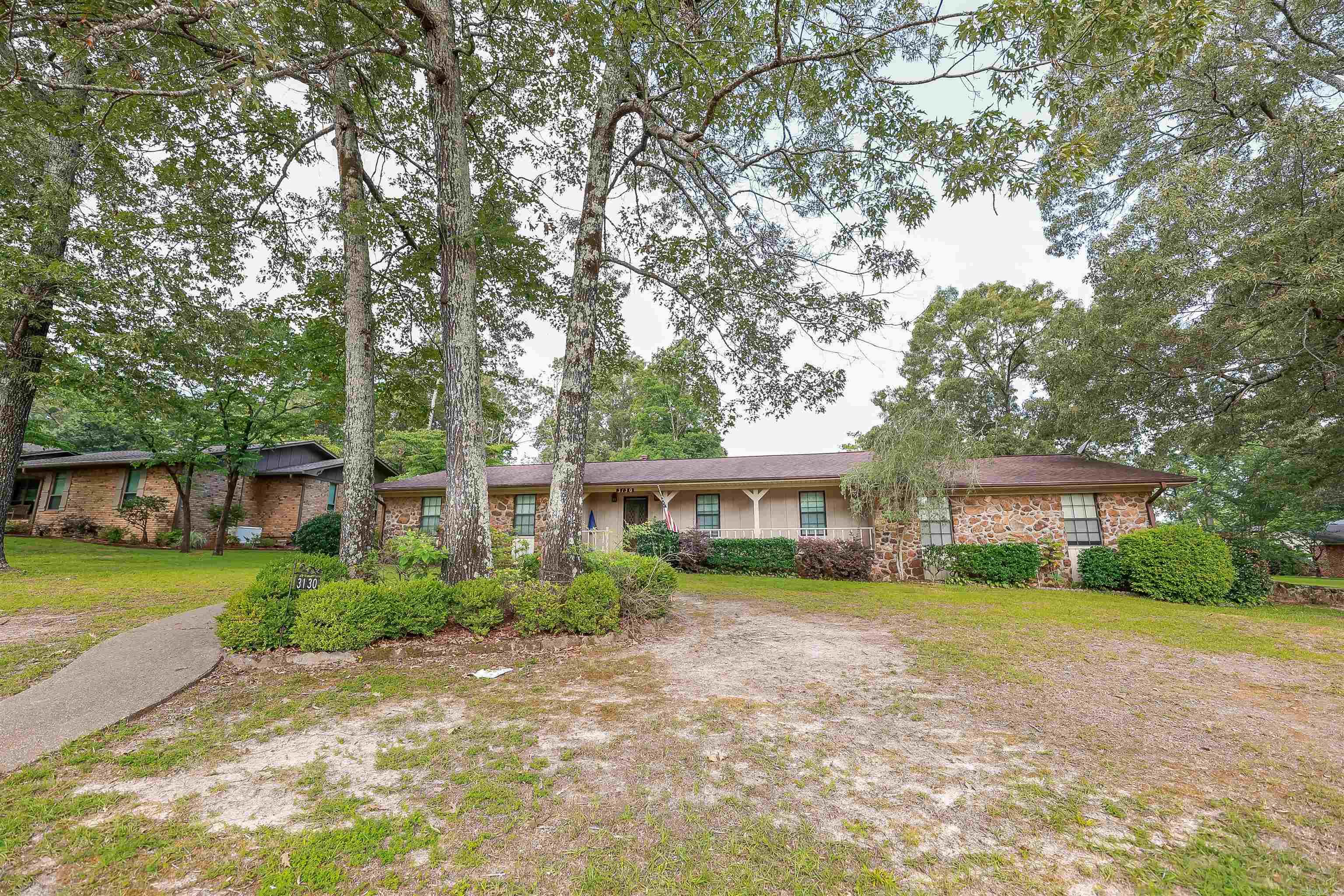 Looking for something with character and room to spread out? This home has it all! From the eye-catching stone exterior to the unique, cozy stone fireplace inside, itās full of charm you wonāt find in just any subdivision house. Youāll love the spacious layout with two living areasāgreat for hosting friends, movie nights, or just giving everyone their own space. The sunroom is a bright and relaxing spot to kick back with your morning coffee or enjoy quiet evenings. And in the case of rough weather, the storm-safe stand located in the garage conveys. Need a spot for projects or extra storage? The detached shop has you covered. And with a privacy fence around the backyard, itās your own little slice of peace and quiet on this lovely corner lot. If youāre looking for a home thatās anything but cookie-cutter, this oneās worth a look!
