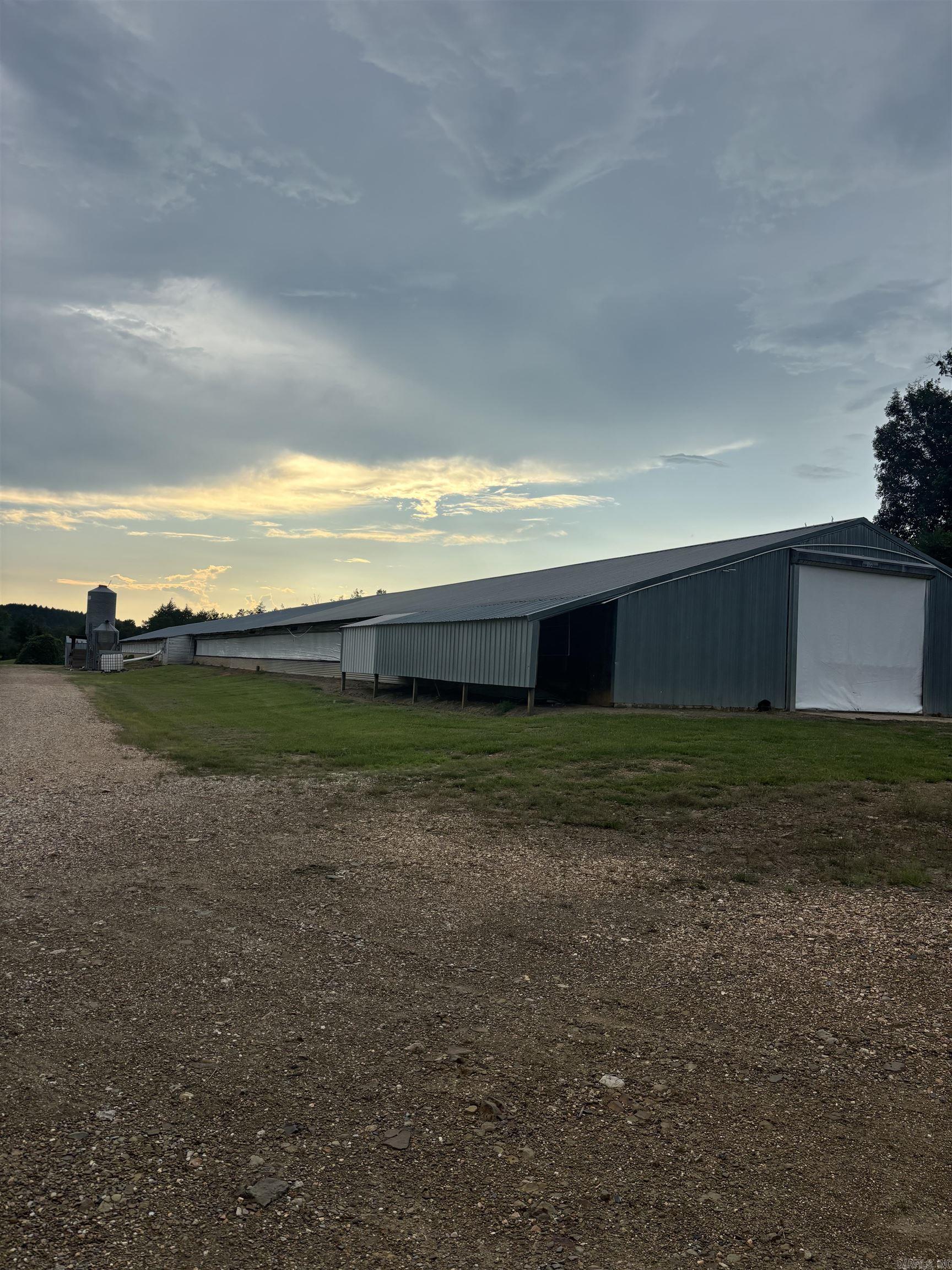 40 acres with 2 40x400 pullet houses, houses have new waters and third feeder lines added, with all updates. Current Grannis-Tyson contract, great investment opportunity. Land offers a perfect spot to build a home. Contact our office for more details.