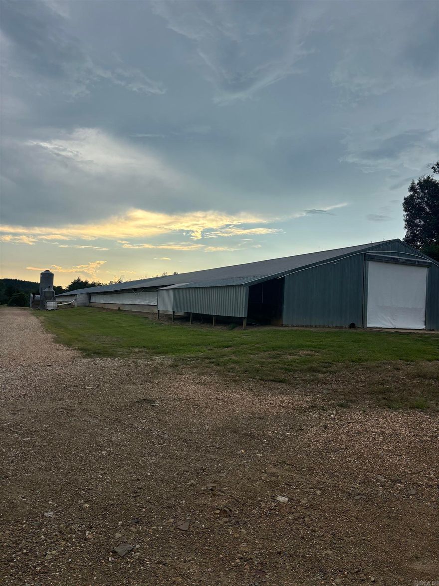 40 acres with 2 40x400 pullet houses, houses have new waters and third feeder lines added, with all updates.  Current Grannis-Tyson contract, great investment opportunity.  Land offers a perfect spot to build a home. Contact our office for more details.