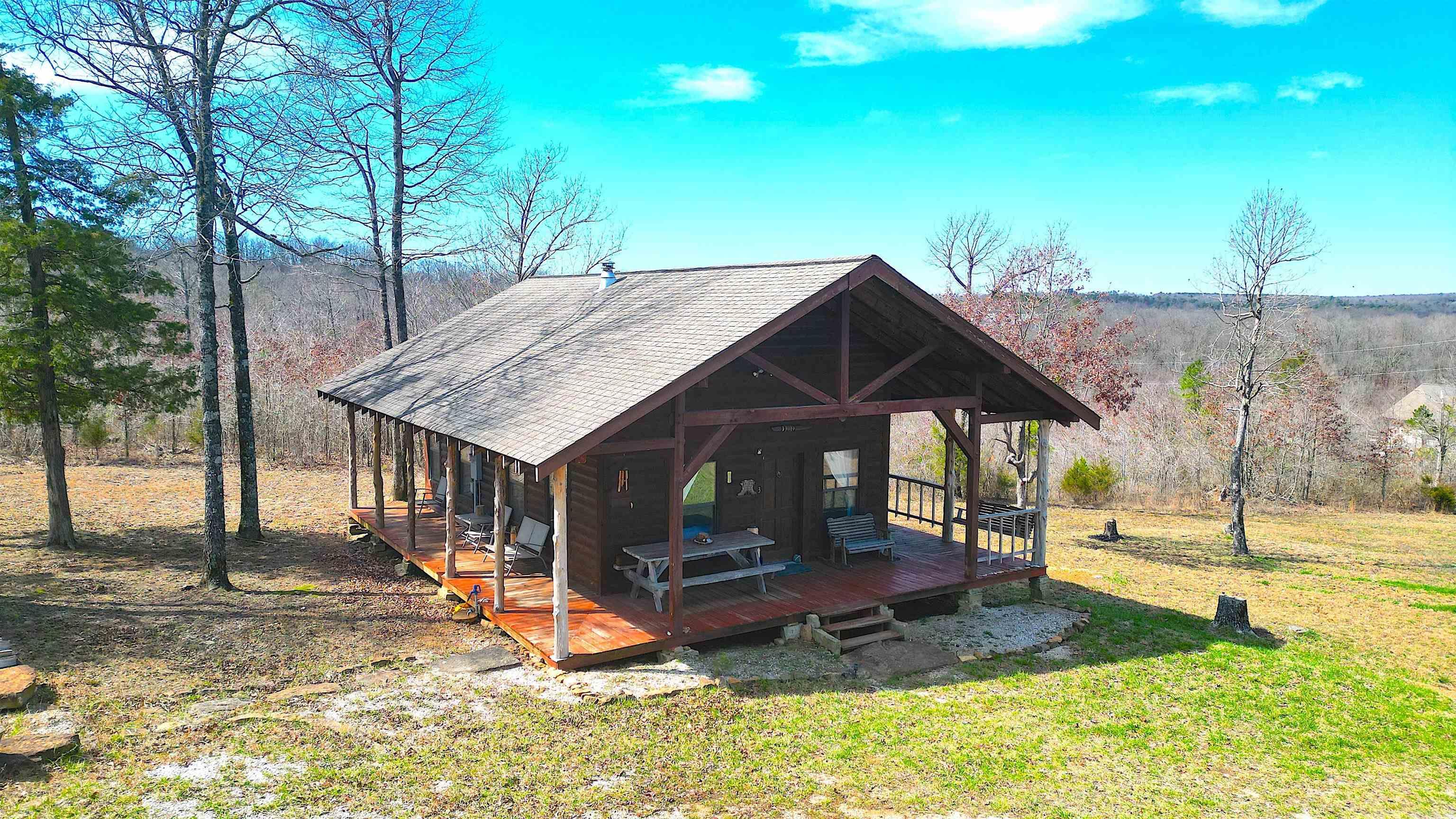 This log cabin with an amazing view is nestled on the side of a mountain just 16 miles outside of Mountain View and only 2 hours north of Little Rock. Youāll love sitting on the wrap around porch and enjoying the serene views and the peace and quiet that only the Ozarks an offer. With one bedroom downstairs and a loft upstairs, that can be used as a second, youāll have plenty of room for your mountain getaways.