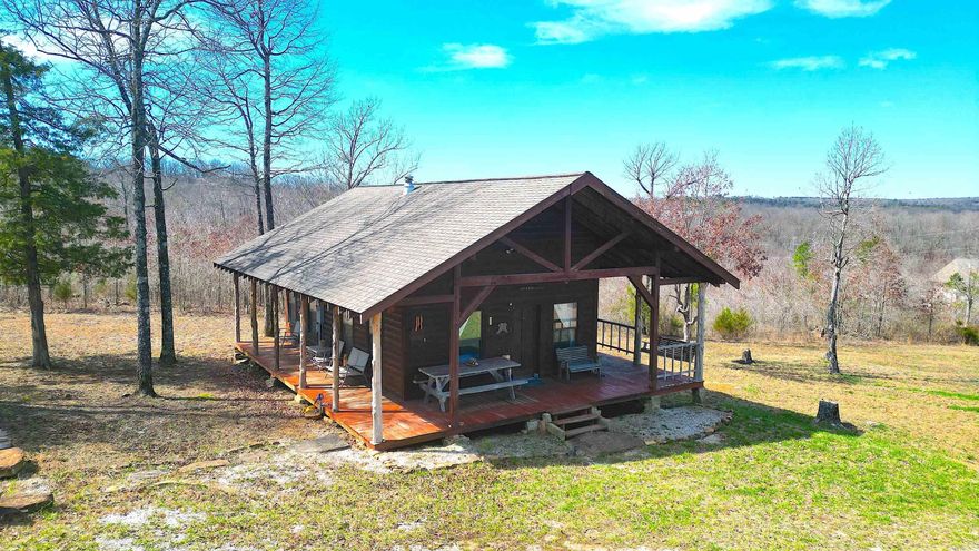 This log cabin with an amazing view is nestled on the side of a mountain just 16 miles outside of Mountain View and only 2 hours north of Little Rock. You’ll love sitting on the wrap around porch and enjoying the serene views and the peace and quiet that only the Ozarks an offer. With one bedroom downstairs and a loft upstairs, that can be used as a second, you’ll have plenty of room for your mountain getaways.