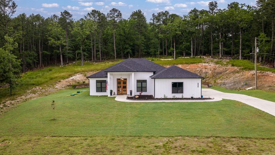 Built in 2025, this beautiful 3-bedroom, 2-bath home offers 2,204 square feet on a spacious ~1.81-acre lot. Conveniently located less than 5 minutes from the Ferndale four way stop and only 8 minutes from shopping and dining amenities such as the Chenal Promenade, Costco, Kroger and more. Features include a welcoming covered front porch with a beautiful oversized stained, wood grain, modern craftsman double front door. Inside you'll find the wonderful kitchen with a large island and breakfast bar that seats three to four, ample cabinet space and living room meant for entertaining, a spacious walk-in pantry, large bedrooms, and a peaceful covered back patio. Don't miss the oversized side-entry two car garage with an insulated garage door and dog washing station in the laundry room.